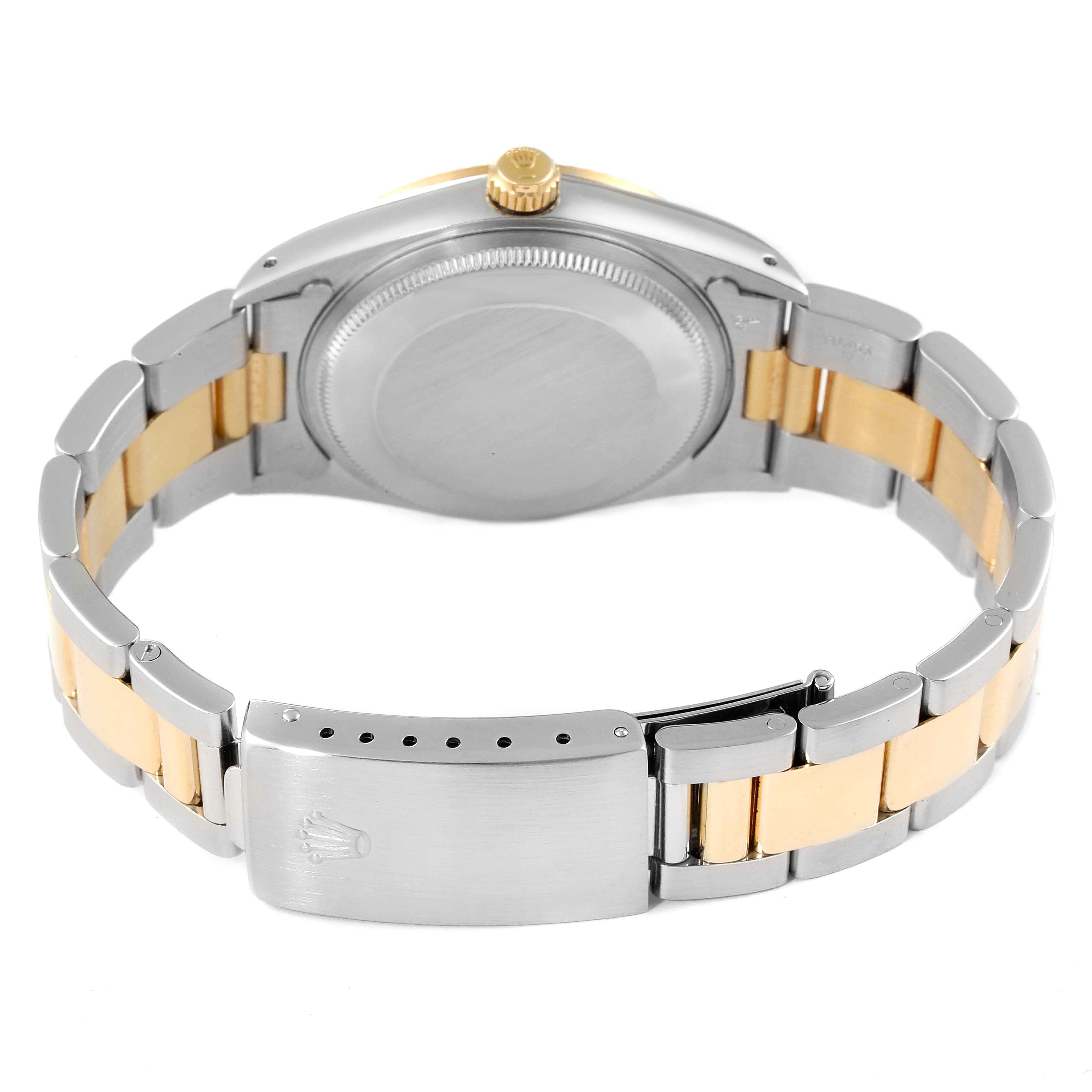 This image shows the back and band of a Rolex Oyster Perpetual 14233 Men's Steel and Gold (two tone) Blue Dial 14233 Men's Steel and Gold (two tone) Blue Dial watch, highlighting the clasp and crown.