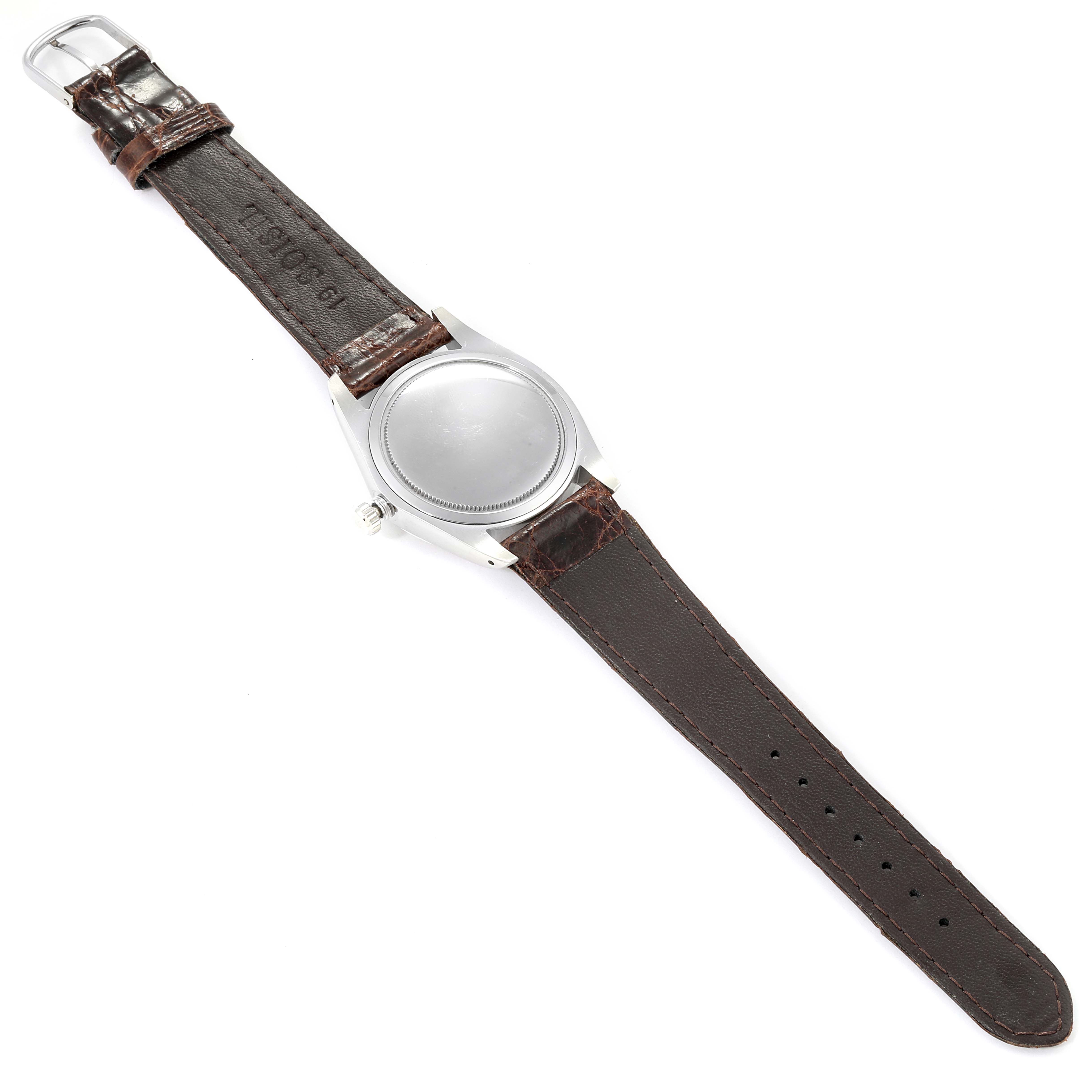 The image shows the back view of a Vintage Collection Rolex watch with a brown leather strap.