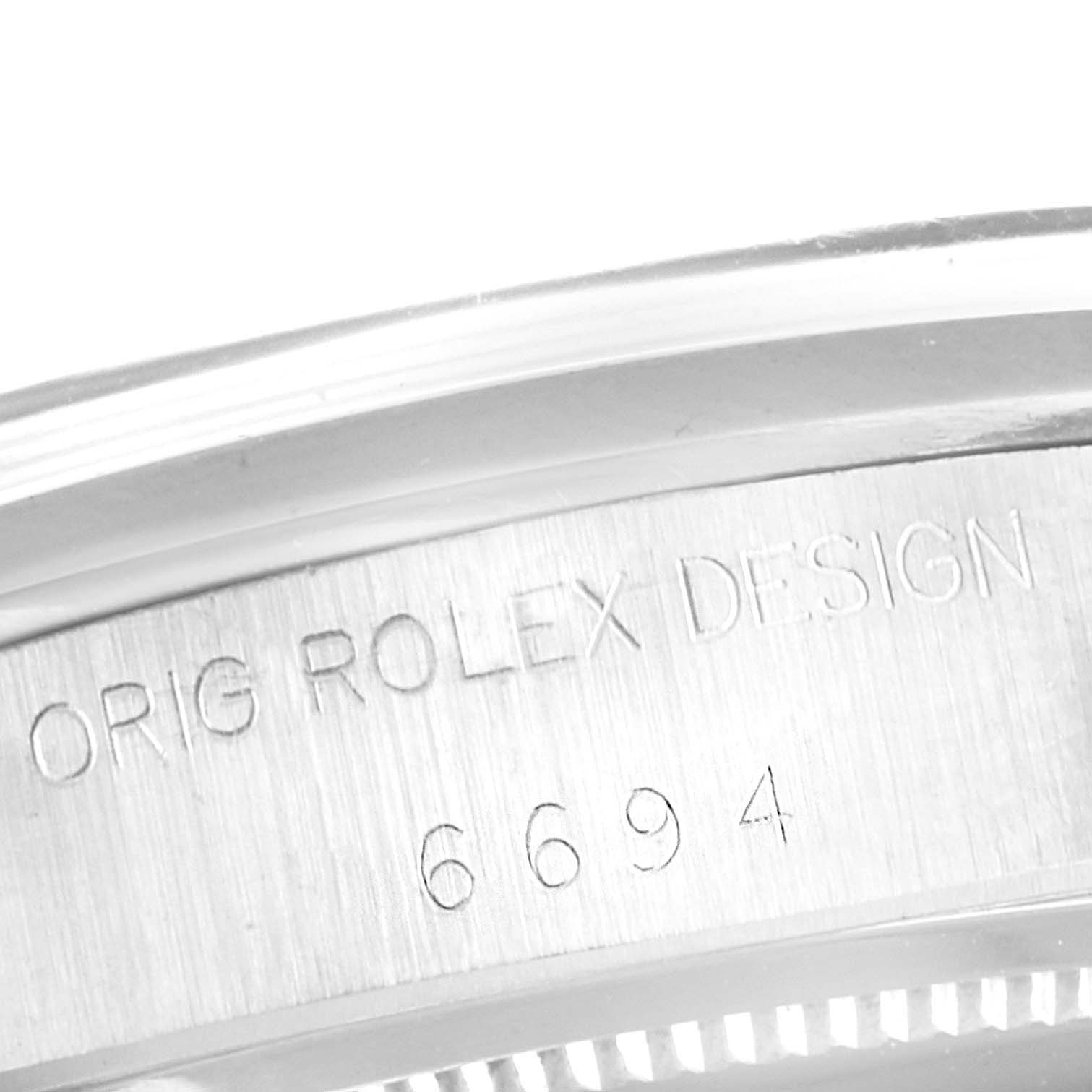 This image shows a close-up view of the case and engravings on a Vintage Collection model Rolex watch.