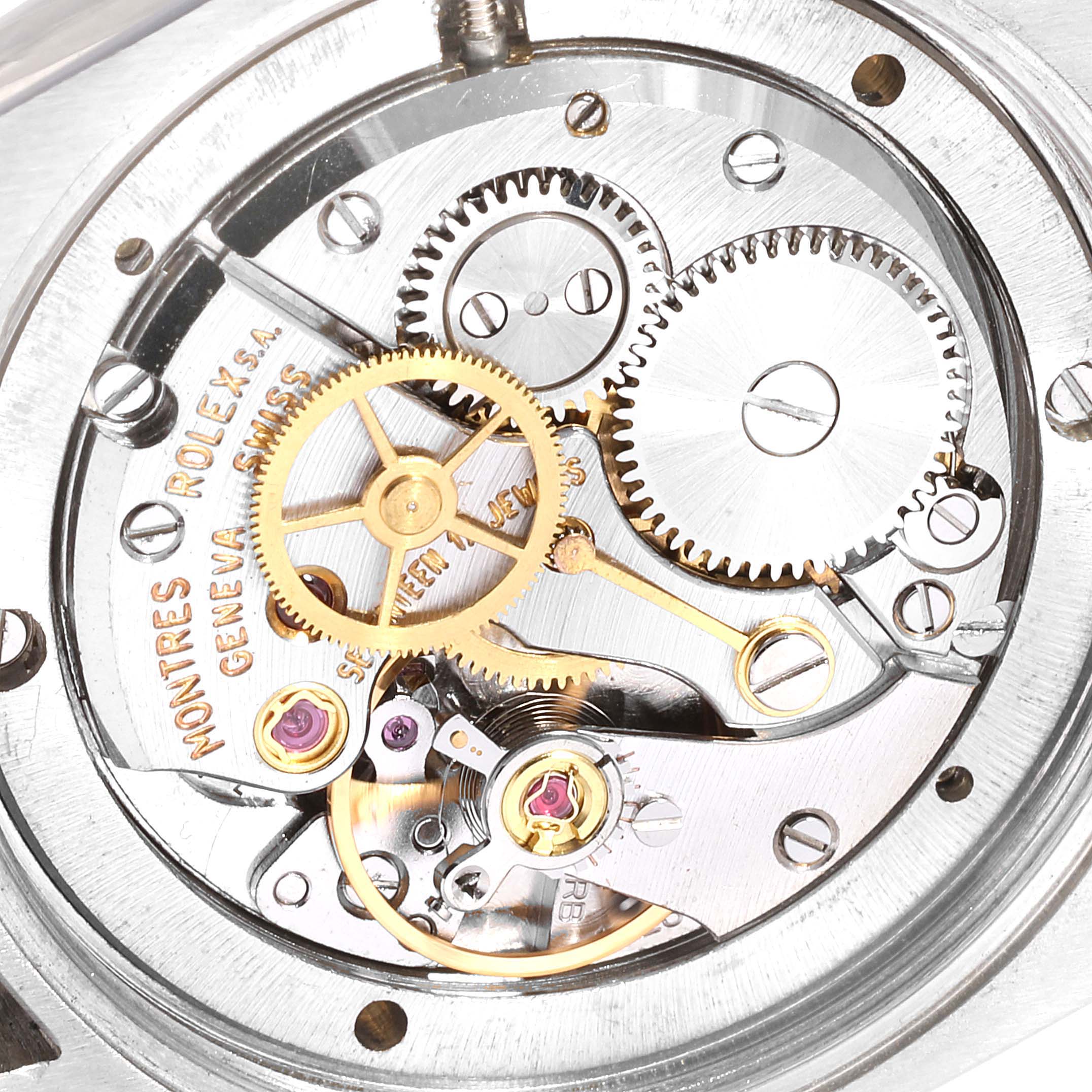 The image shows a close-up of the internal mechanism of the Rolex Vintage Collection 6694 Men's Stainless Steel Champagne Dial 6694 Men's Stainless Steel Champagne Dial watch, highlighting gears and components.