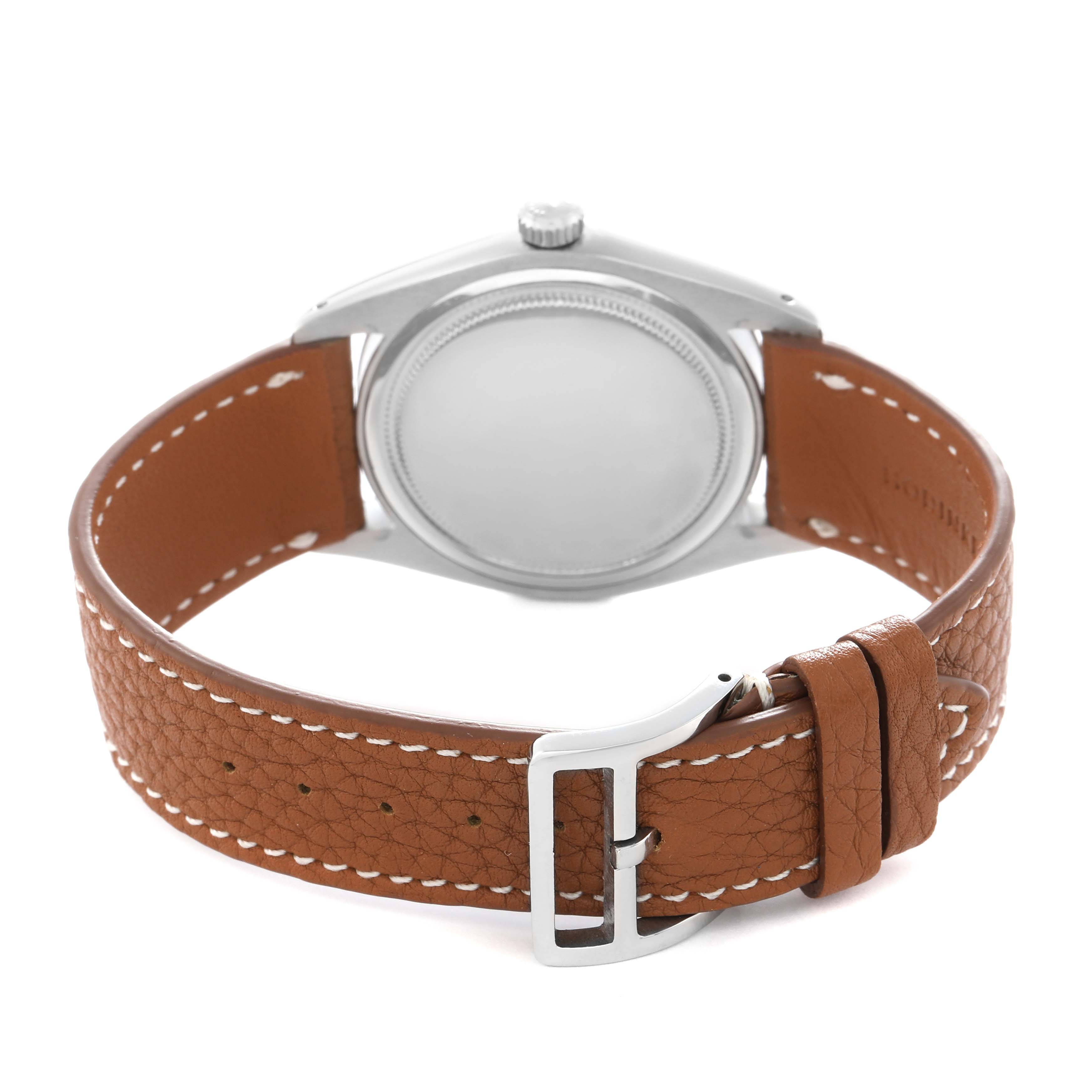 The watch is a Rolex Date 6694 Men
s Stainless Steel Silver Dial 6694 Men
s Stainless Steel Silver Dial model shown from the back, featuring a leather strap and case back.