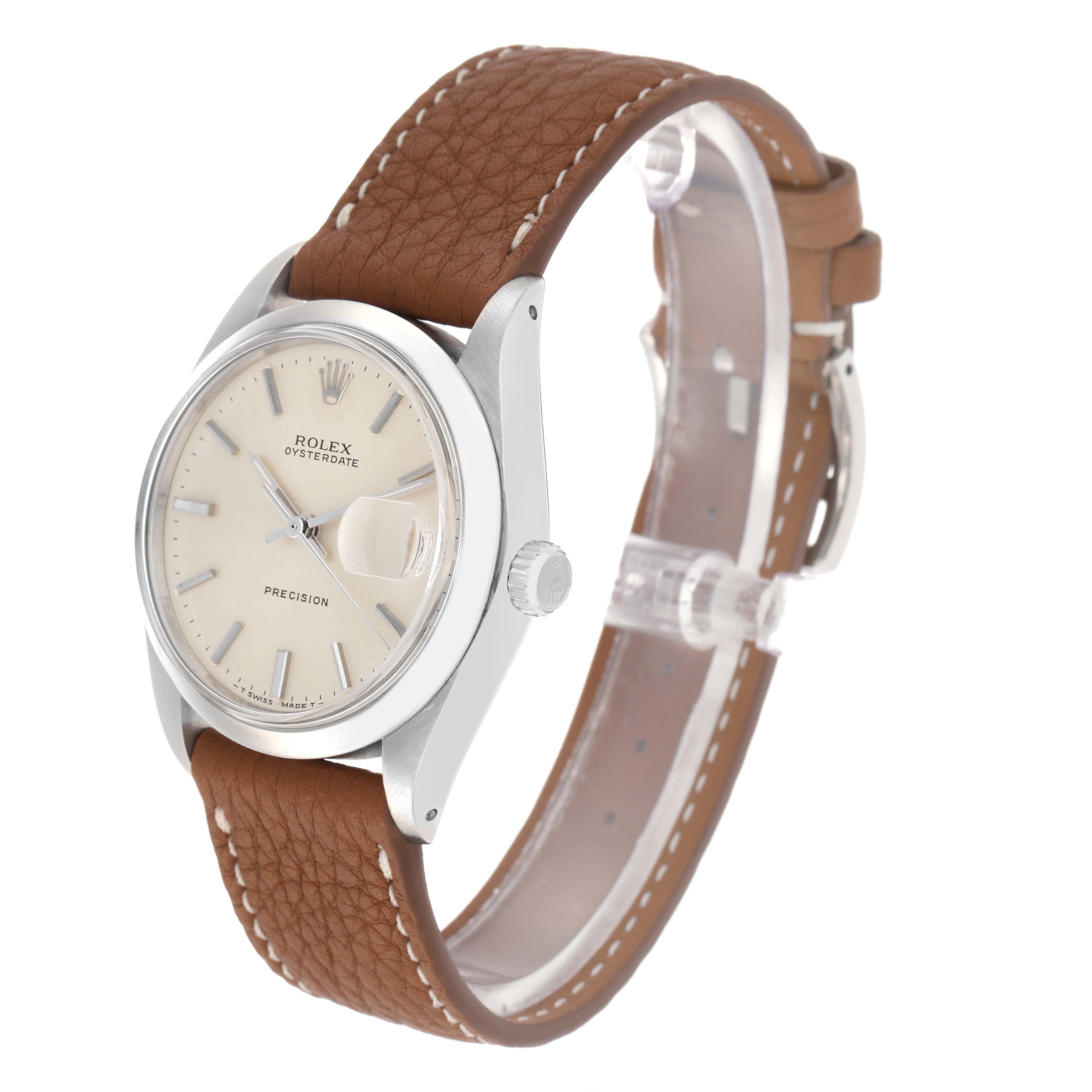 The Rolex Date 6694 Men
s Stainless Steel Silver Dial 6694 Men
s Stainless Steel Silver Dial watch is shown at a three-quarter angle, displaying the dial, bezel, crown, and leather strap.