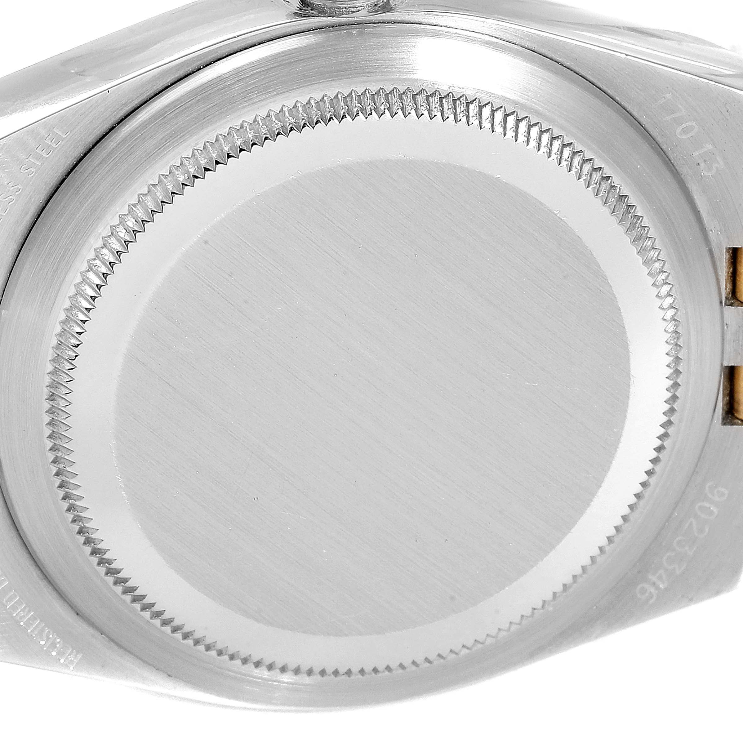 This image shows the case back of a Rolex Oysterquartz 17013 Men
s Steel and Gold (two tone) Champagne Dial 17013 Men
s Steel and Gold (two tone) Champagne Dial watch from a close-up angle.