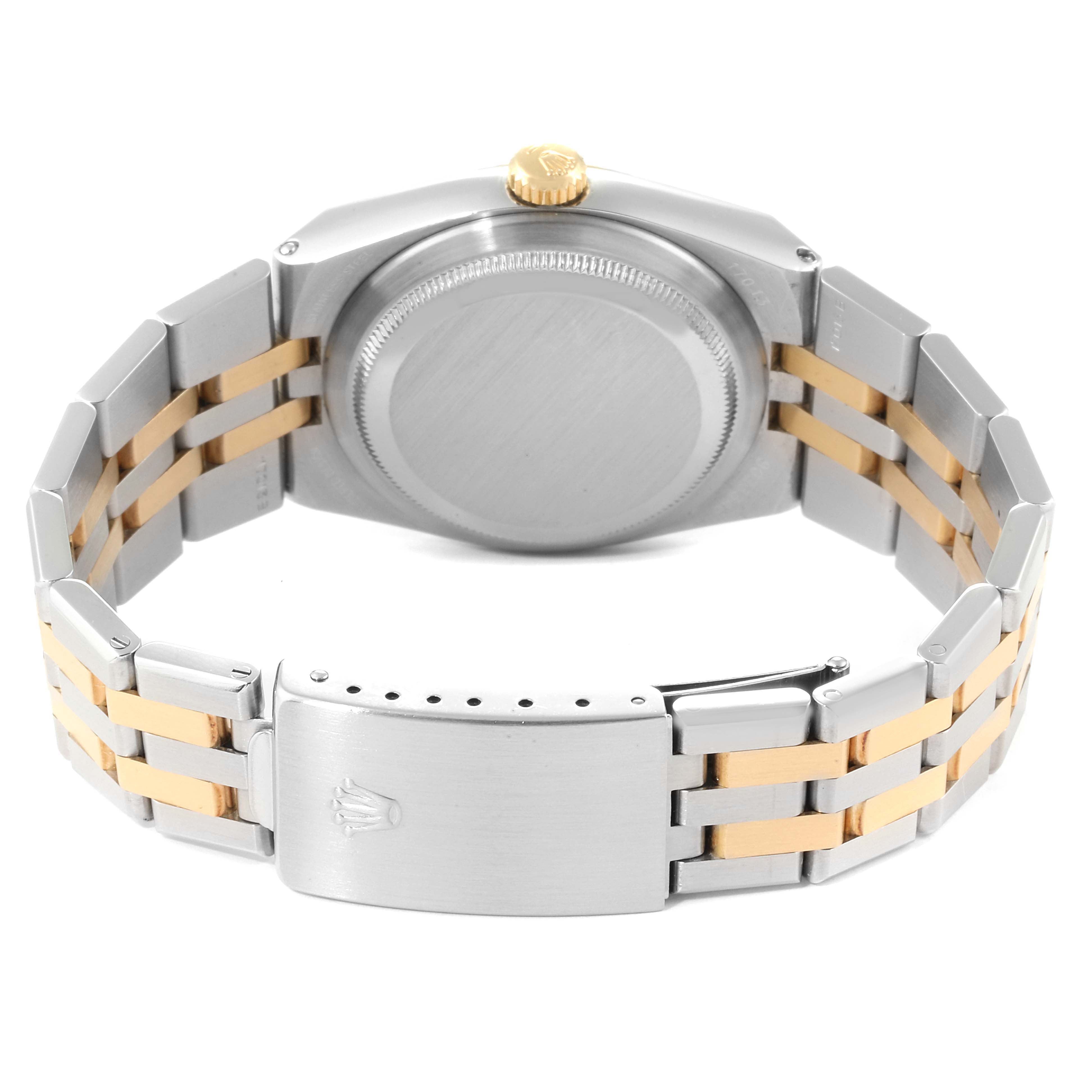 The image shows the back case and bracelet of a Rolex Oysterquartz 17013 Men
s Steel and Gold (two tone) Champagne Dial 17013 Men
s Steel and Gold (two tone) Champagne Dial watch from a rear angle.