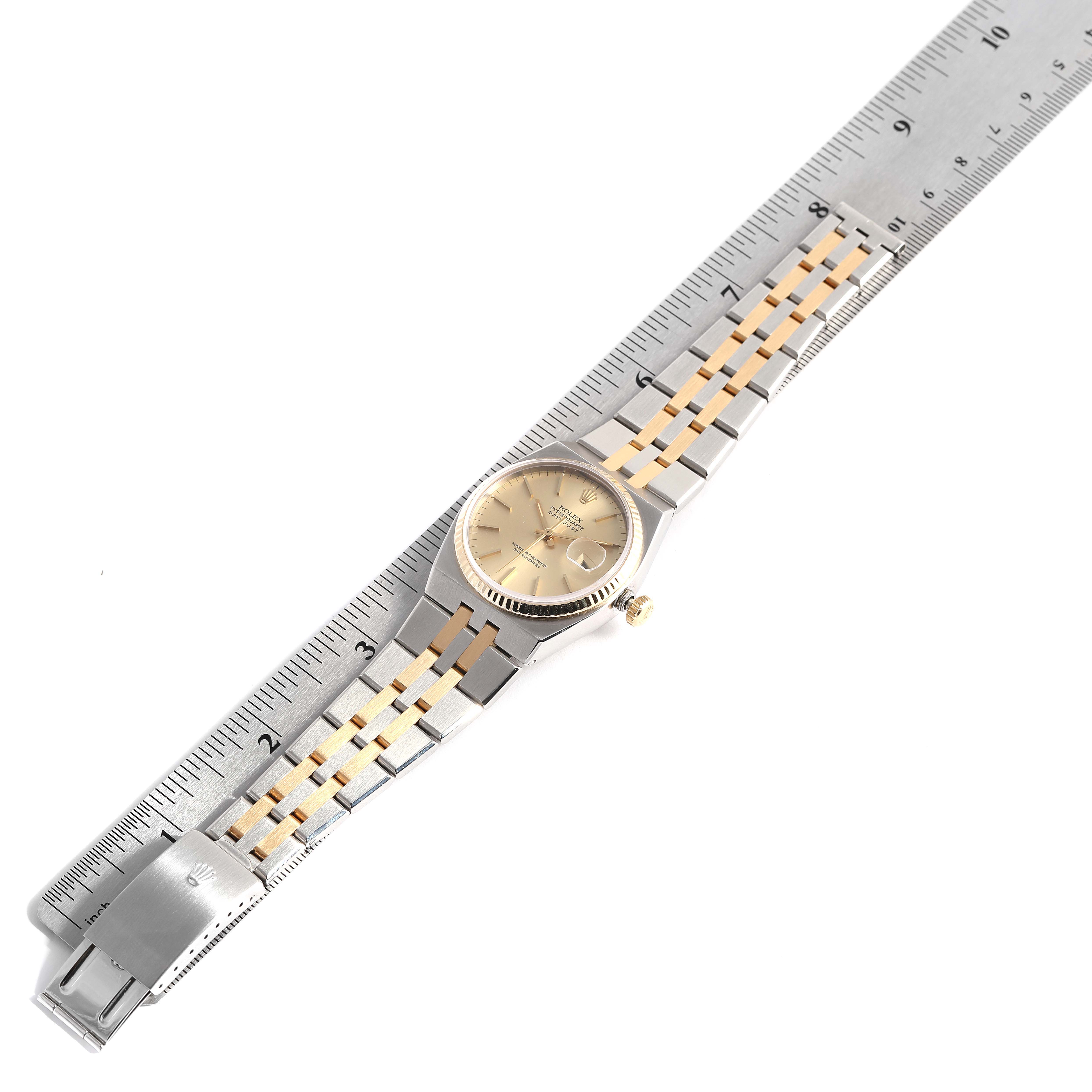 The Rolex Oysterquartz 17013 Men
s Steel and Gold (two tone) Champagne Dial 17013 Men
s Steel and Gold (two tone) Champagne Dial watch is shown from a top-down angle, with its face, band, and crown visible.