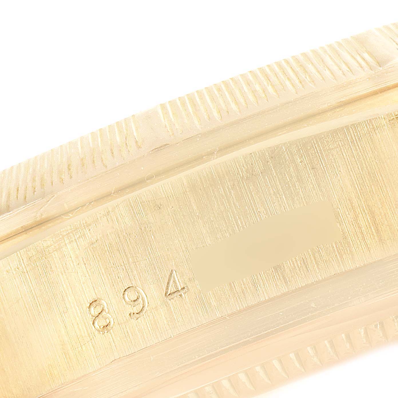 The image shows a close-up of the case side and engraved serial number of a Rolex President 18078 Men's Yellow Gold Blue Dial 18078 Men's Yellow Gold Blue Dial model watch.