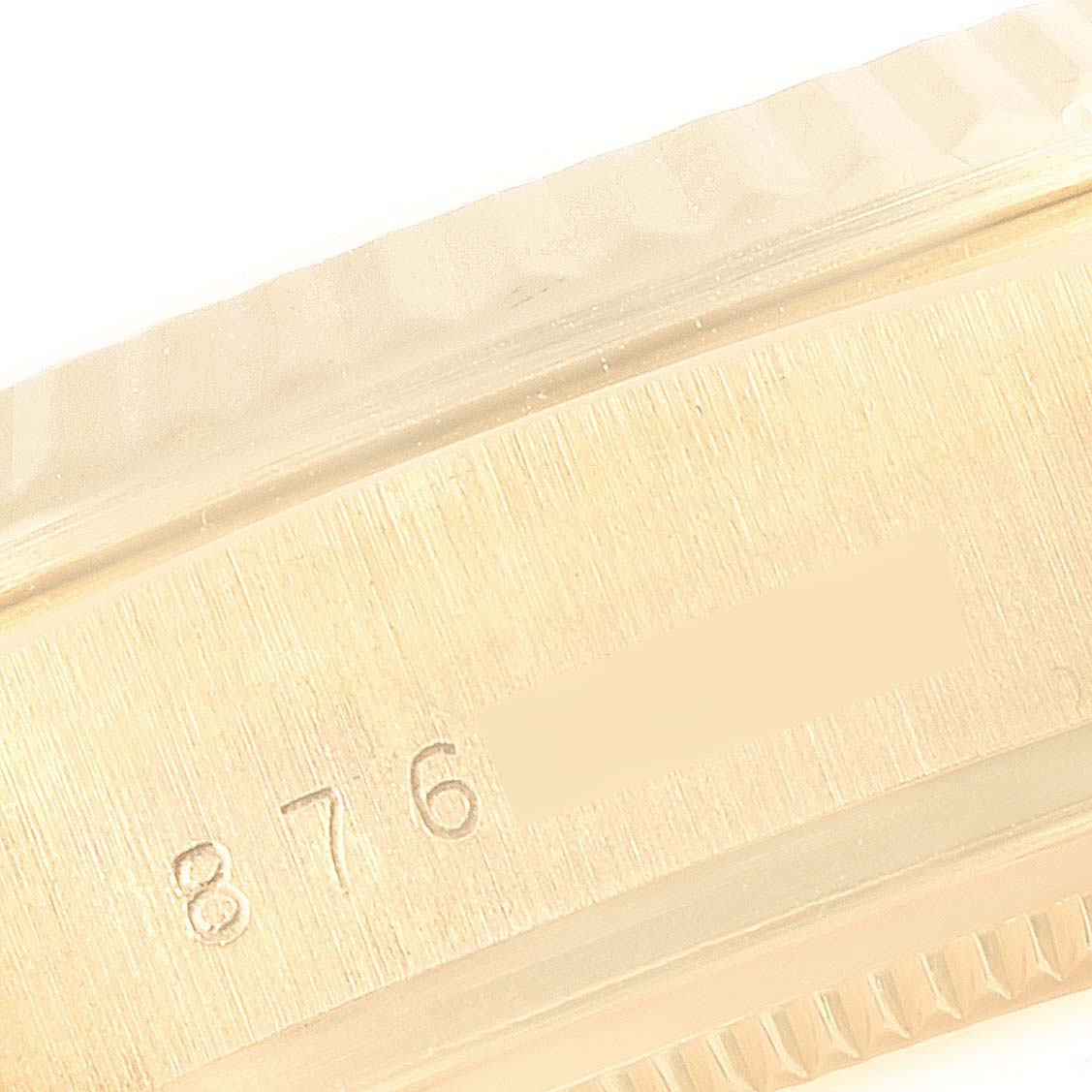 This image shows a close-up of the serial number engraved on the side of the casing of a Rolex President 18038 Men's Yellow Gold Black Dial 18038 Men's Yellow Gold Black Dial model watch.