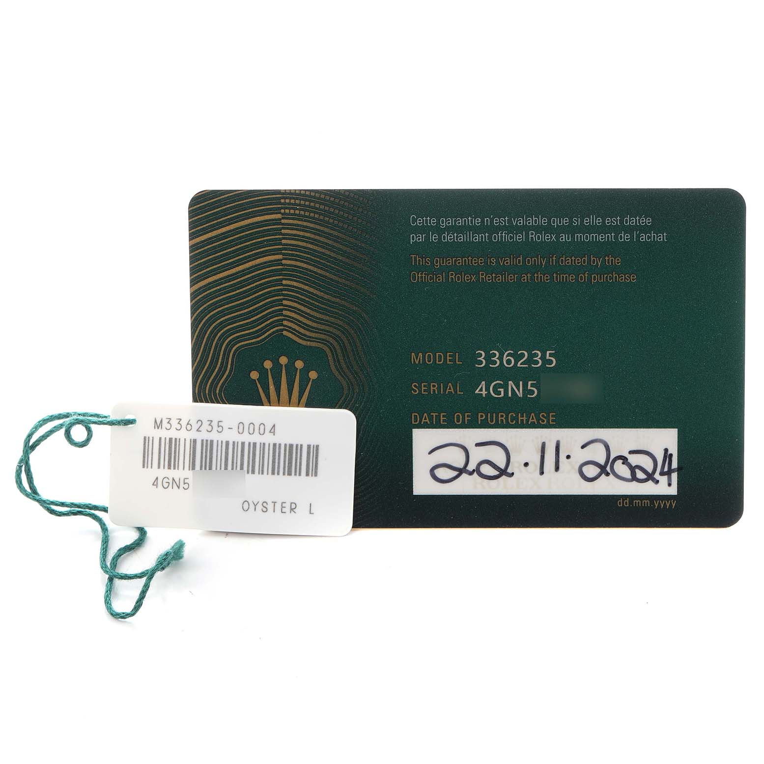 The image shows the warranty card and tag for a Rolex Sky-Dweller 336235 Men
s Rose Gold Grey Dial 336235 Men
s Rose Gold Grey Dial watch, including the model number and purchase date.
