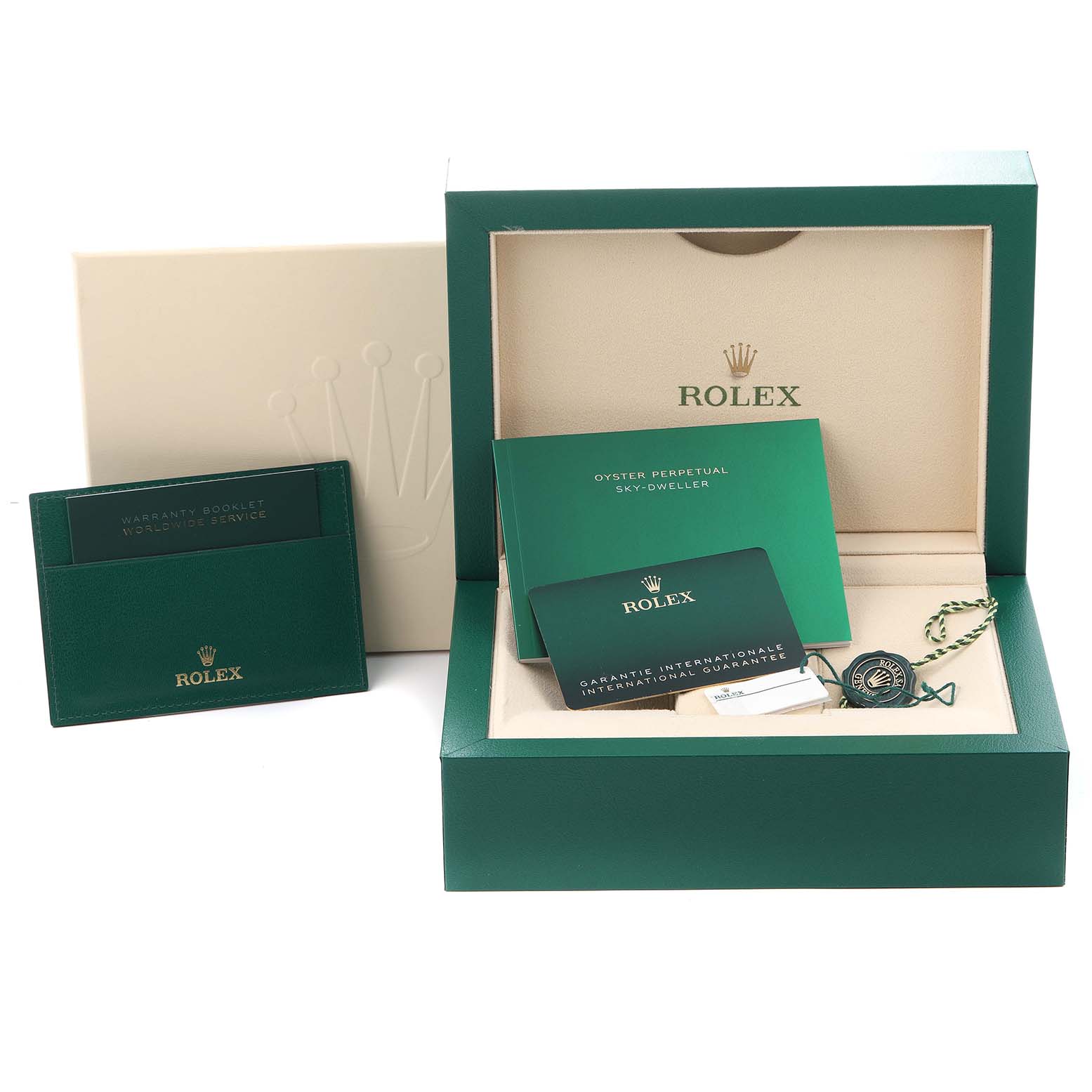 The image shows a Rolex Sky-Dweller 336235 Men
s Rose Gold Grey Dial 336235 Men
s Rose Gold Grey Dial box set, including the green box, warranty booklet, and guarantee card.