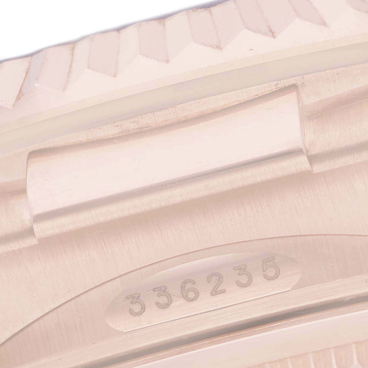 The image shows a close-up of the bezel and part of the case of a Rolex Sky-Dweller 336235 Men
s Rose Gold Grey Dial 336235 Men
s Rose Gold Grey Dial, focusing on the reference number.