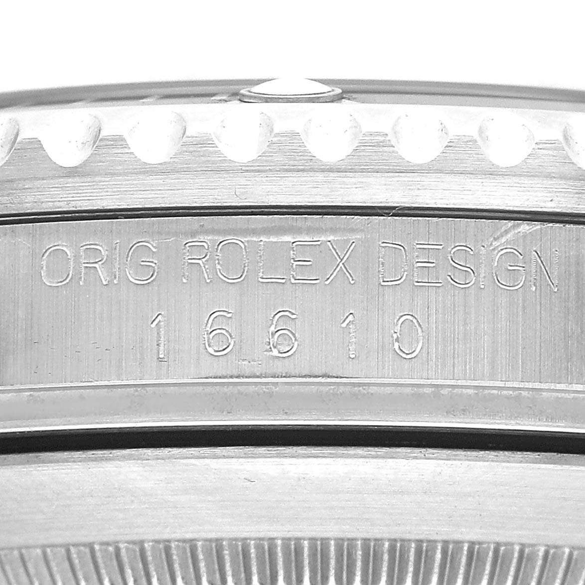 The image shows the side engraving of a Rolex Submariner 16610 Men's Stainless Steel Black Dial, model number 16610.