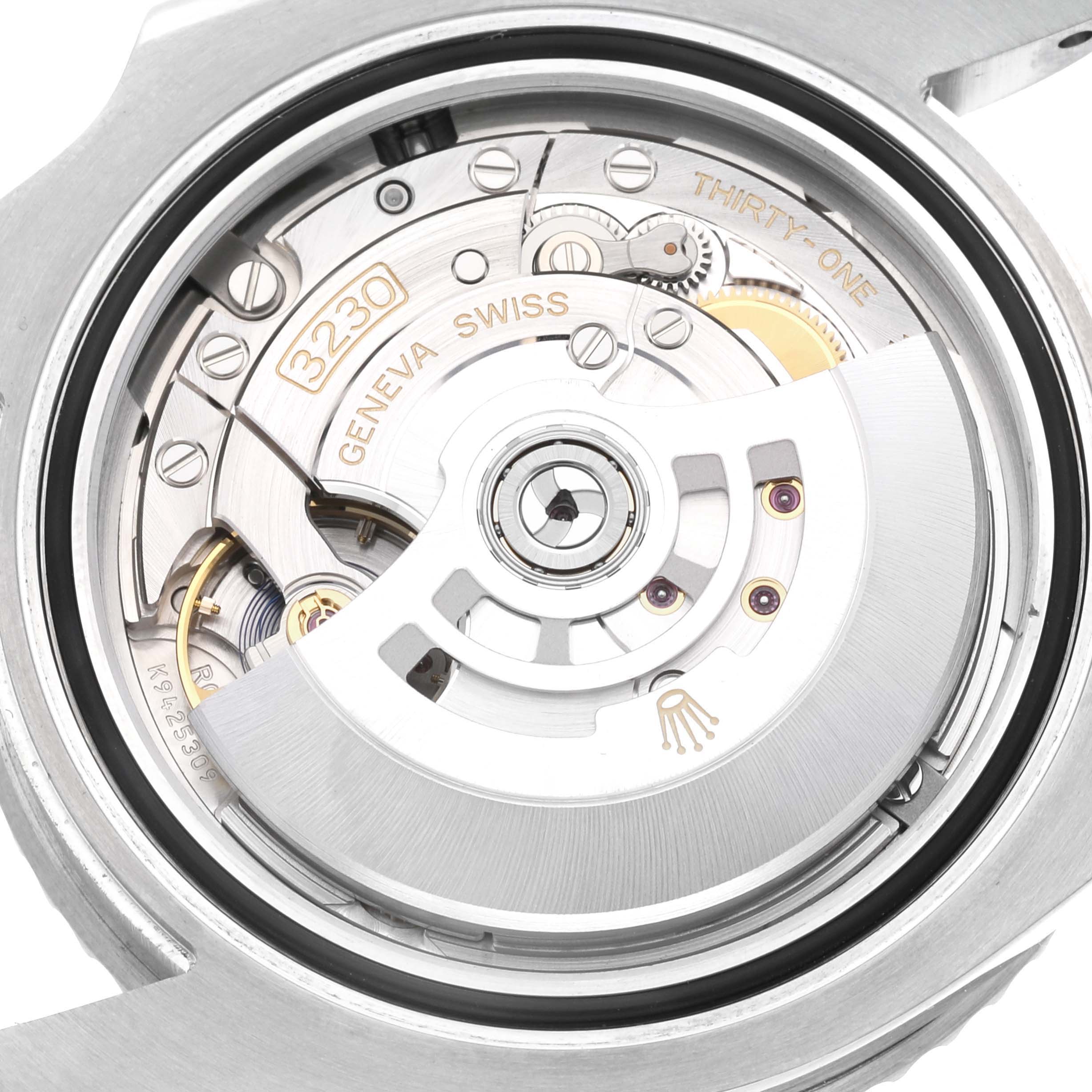 The image shows a close-up view of the Rolex Submariner 124060 Men
s Stainless Steel Black Dial 124060 Men
s Stainless Steel Black Dial
s open case back, revealing the intricate movement mechanism.