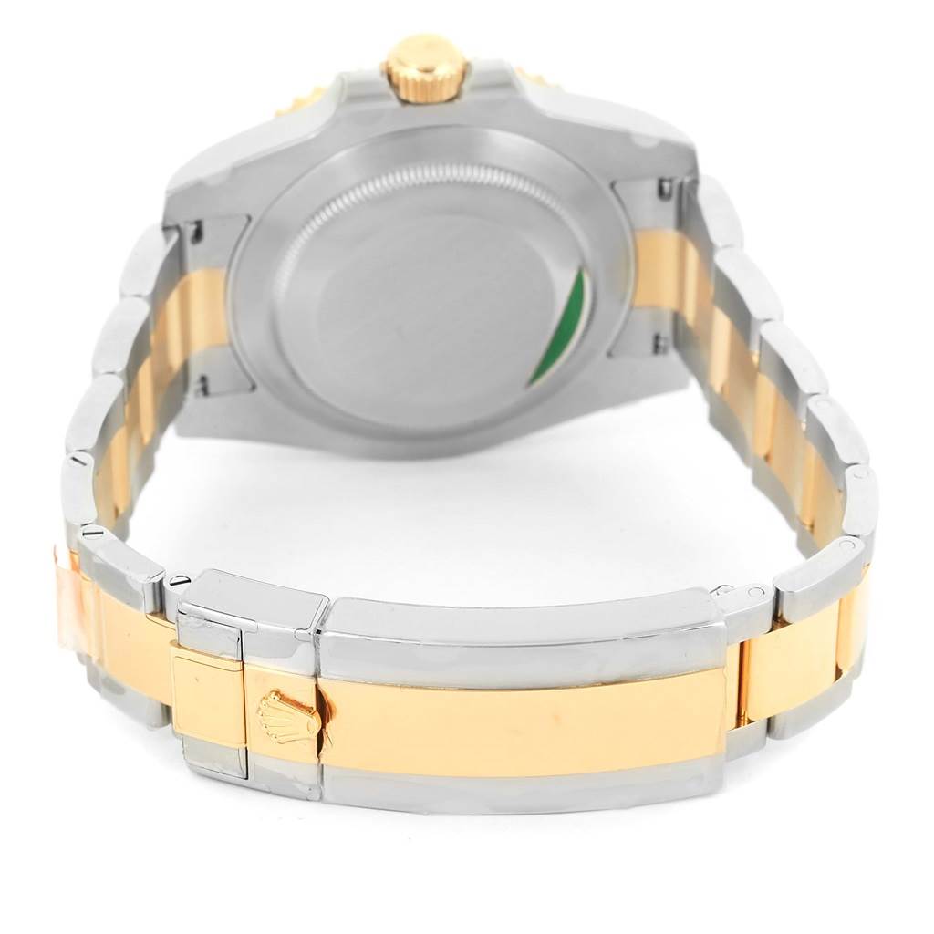 The image shows the back case and bracelet of a Rolex Submariner 116613 Men
s Steel and Gold (two tone) Blue Dial 116613 Men
s Steel and Gold (two tone) Blue Dial, highlighting its two-tone metal design and clasp.