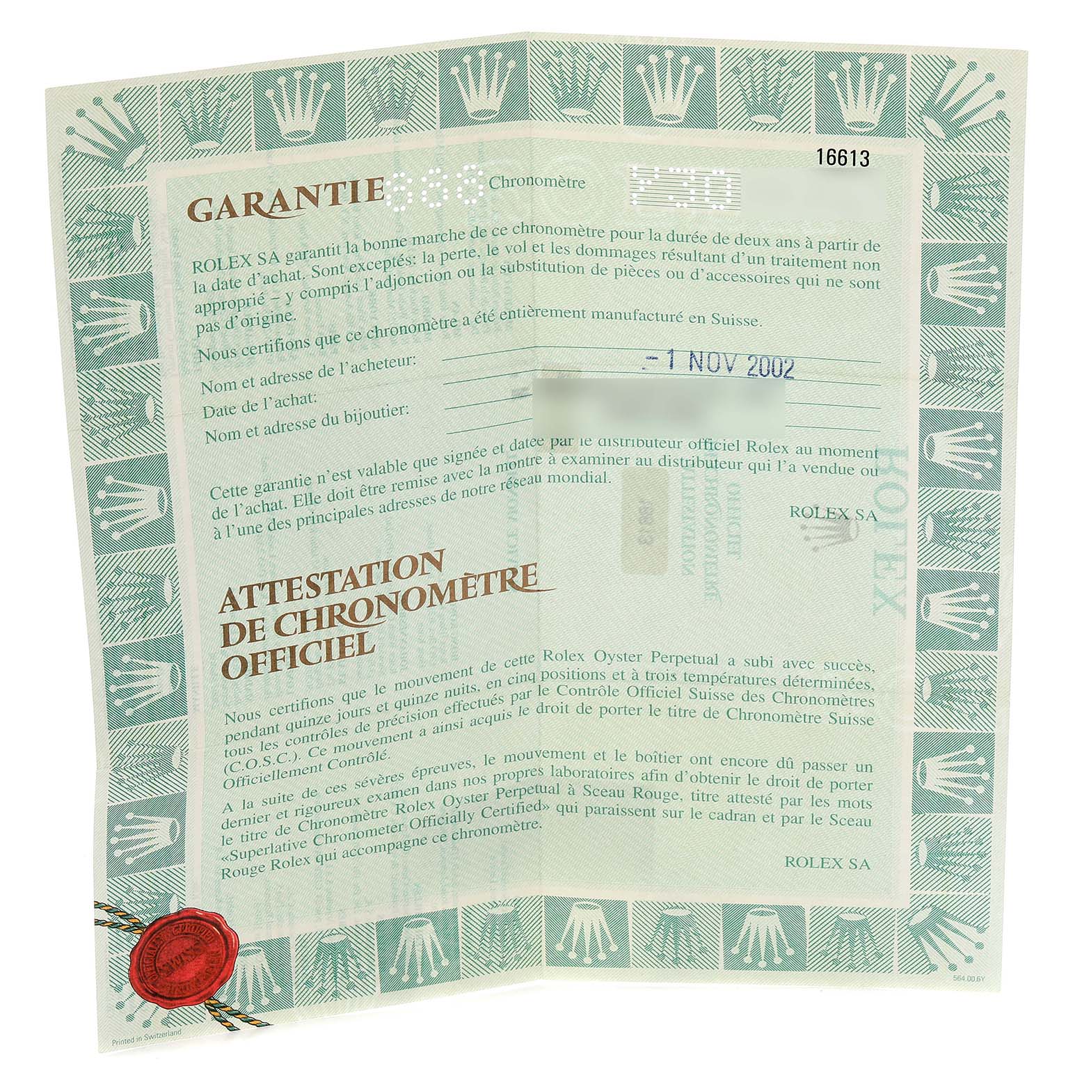 The image shows a Rolex Submariner 16613 Men
s Steel and Gold (two tone) Blue Dial 16613 Men
s Steel and Gold (two tone) Blue Dial warranty certificate featuring brand logos and detailed text, viewed from above.