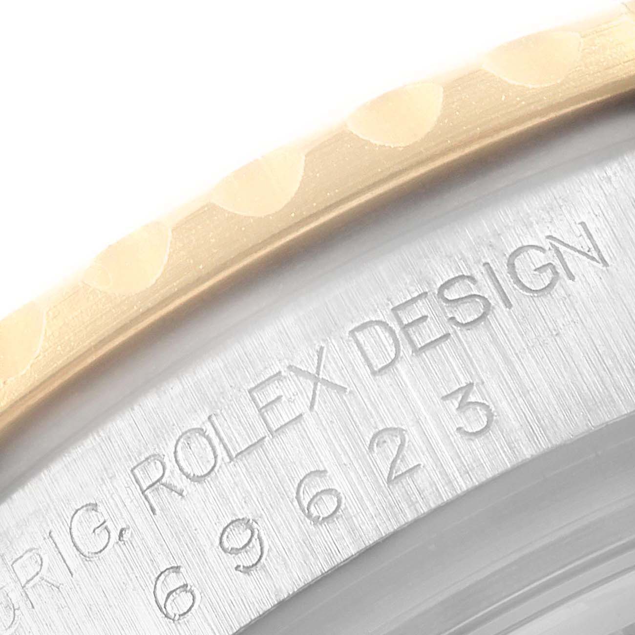 Close-up of the Rolex Yacht-Master 69623 Women's Steel and Gold (two tone) White Dial 69623 Women's Steel and Gold (two tone) White Dial model's bezel and engraving.