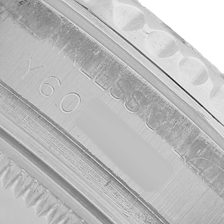 This close-up image shows the bezel and engraved details of a Rolex Yacht-Master 168622 Men's Stainless Steel Silver Dial watch.