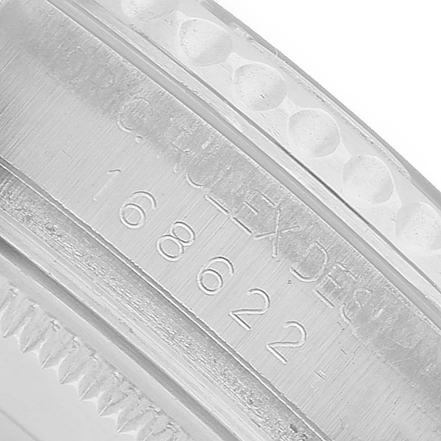 The image shows a close-up of the side of a Rolex Yacht-Master 168622 Men's Stainless Steel Silver Dial, highlighting the engraved model number and detailing.
