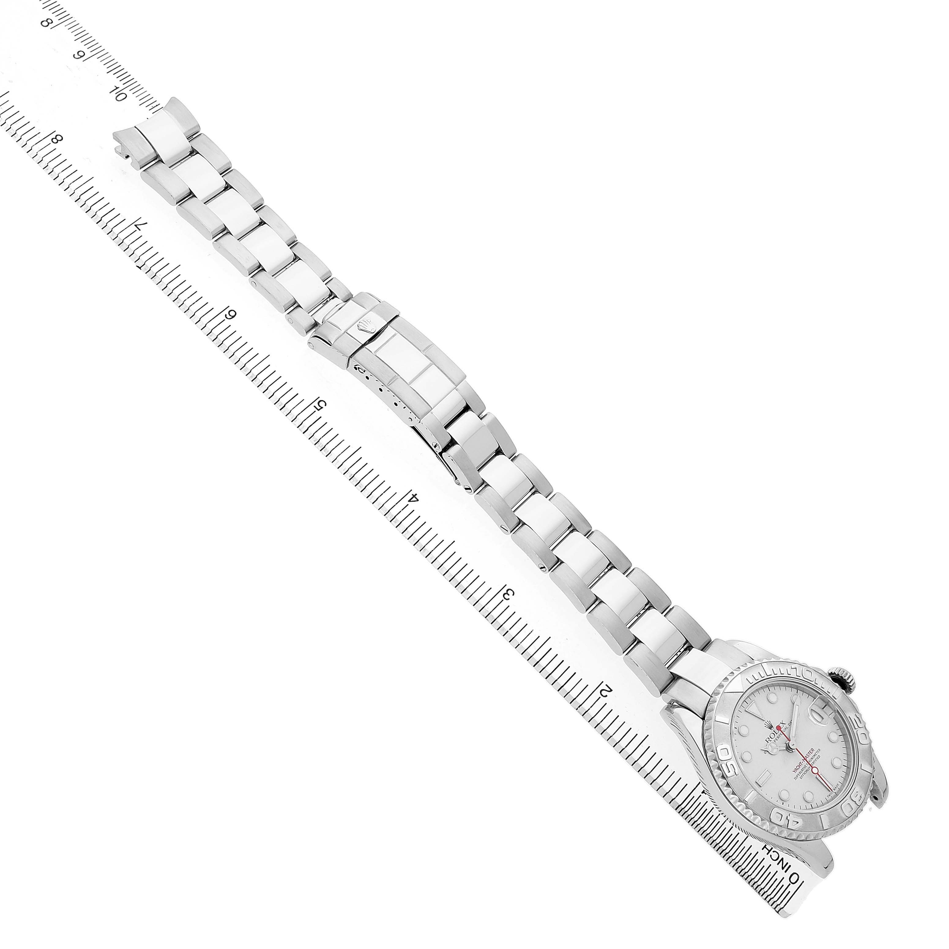 The Rolex Yacht-Master 168622 Men's Stainless Steel Silver Dial watch is displayed diagonally, showing the full bracelet and face alongside a ruler for scale.