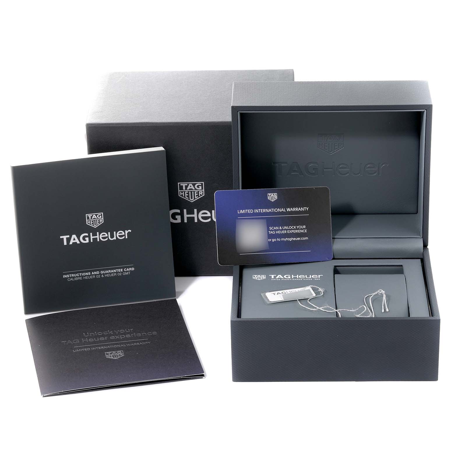 The image shows the Tag Heuer Monaco CBL2111.BA0644 Men
s Stainless Steel Blue Dial CBL2111.BA0644 Men
s Stainless Steel Blue Dial packaging, including the box, warranty card, and instruction booklet.