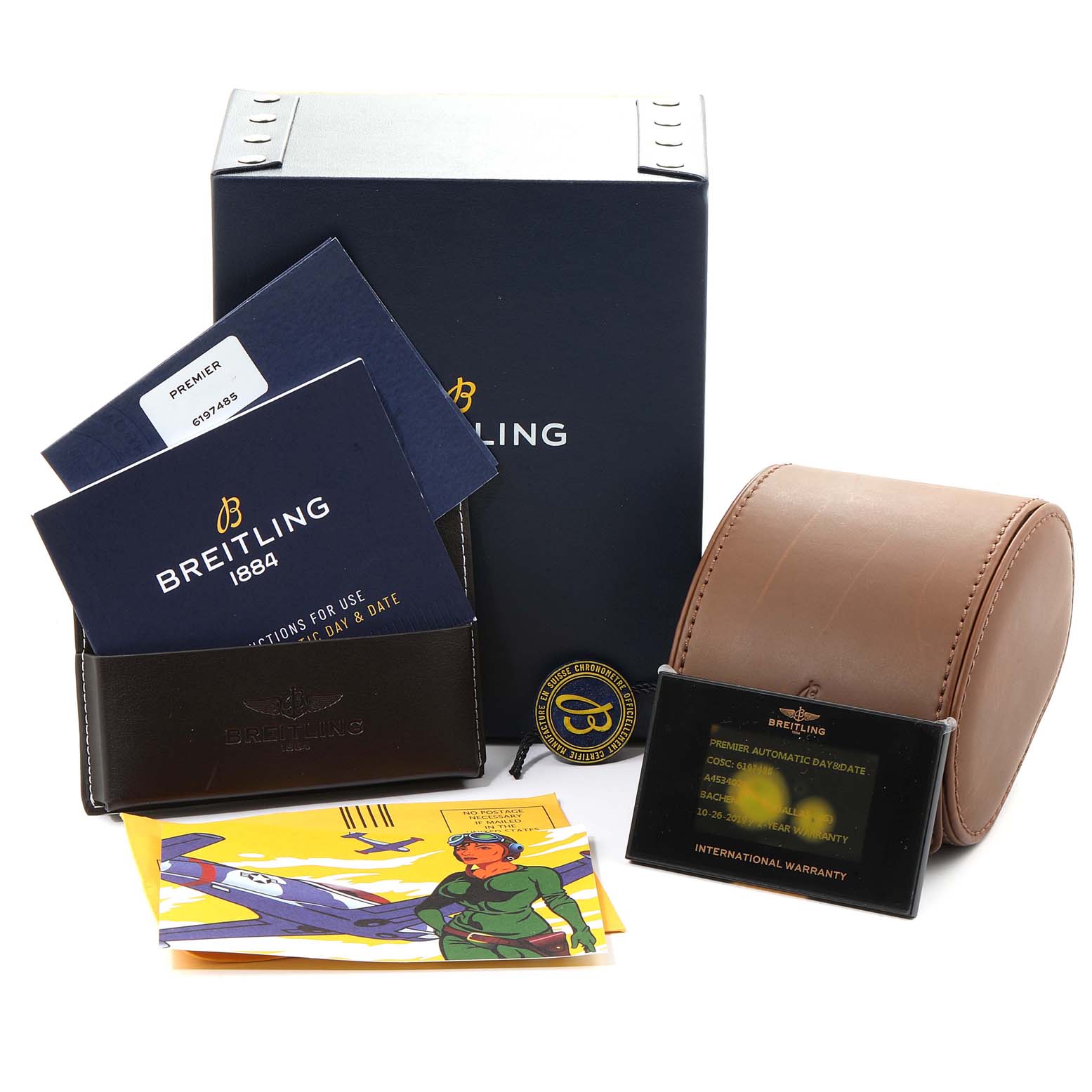 The image shows packaging and accessories for a Premier model by Breitling, including boxes, booklets, a case, and warranty cards.