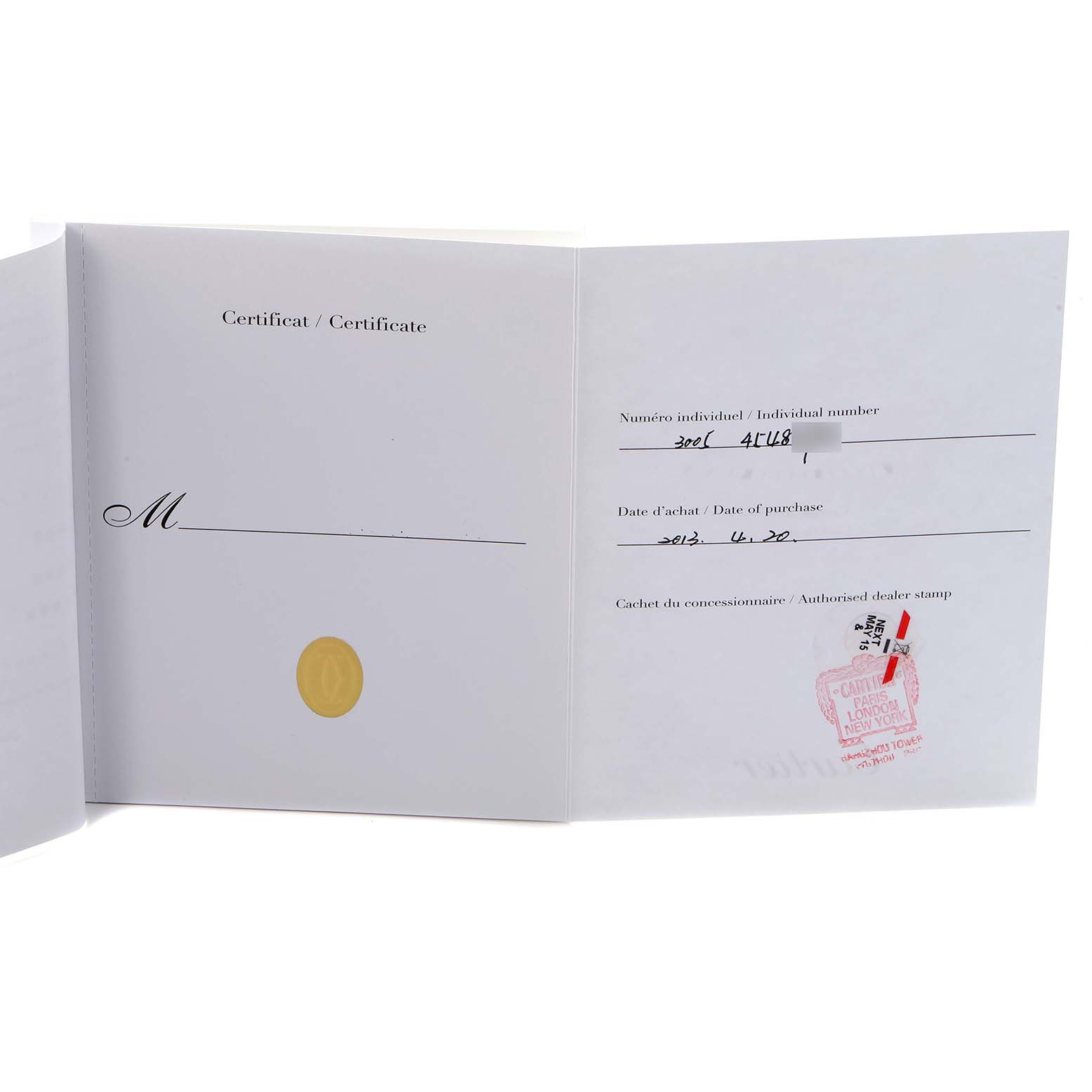 The image shows an open certificate booklet for a Cartier Ballon Bleu W69011Z4 Men
s Stainless Steel Silver Dial W69011Z4 Men
s Stainless Steel Silver Dial watch with purchase details and dealer stamp.