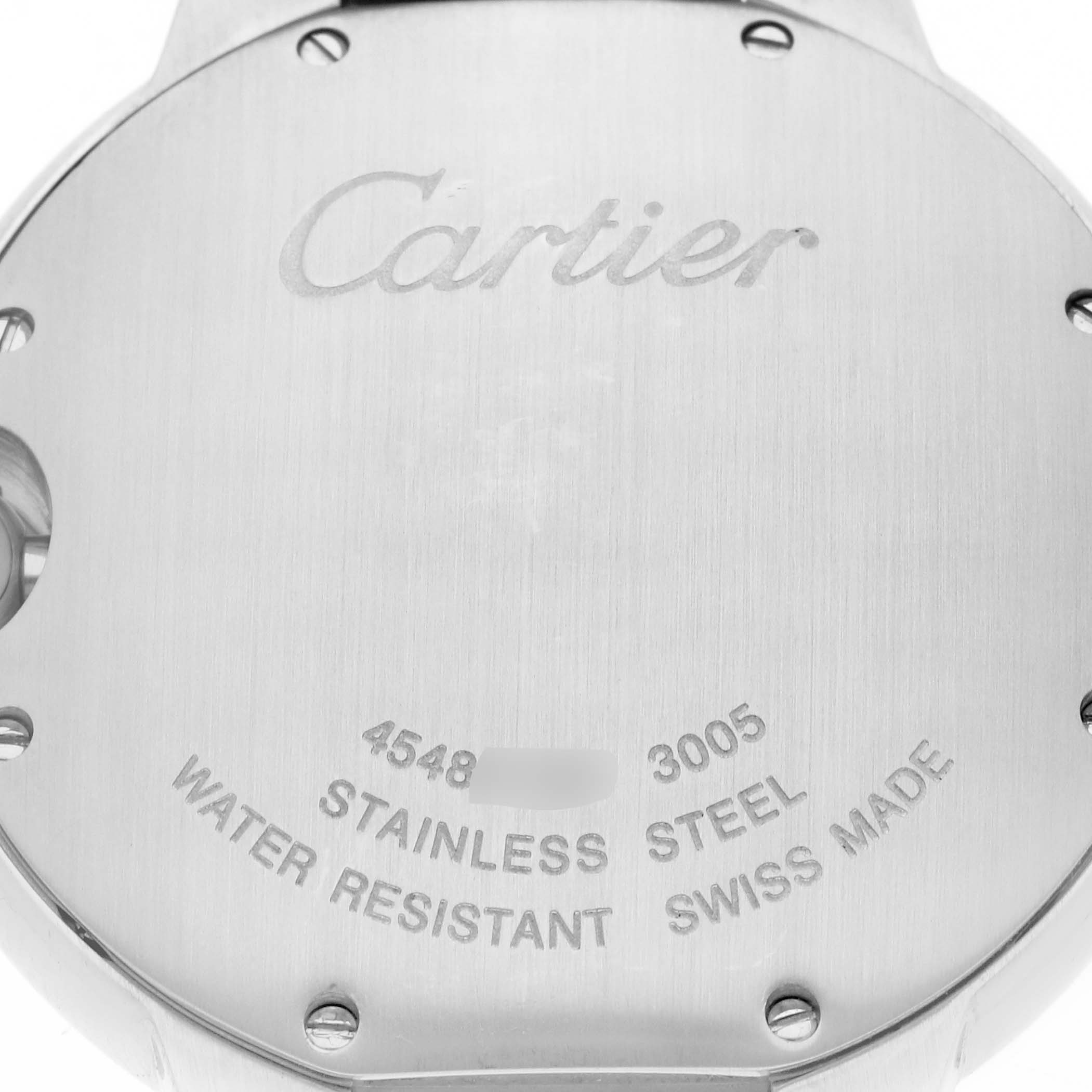 The image shows the back of a Cartier Ballon Bleu W69011Z4 Men
s Stainless Steel Silver Dial W69011Z4 Men
s Stainless Steel Silver Dial watch with engraved branding and specifications.