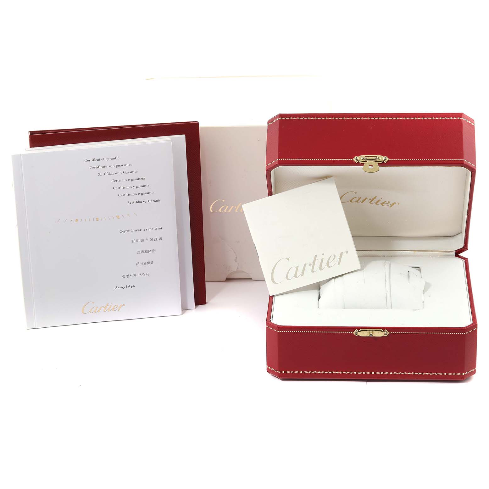 The image shows the packaging, box, and manuals for the Calibre de Cartier model by Cartier.