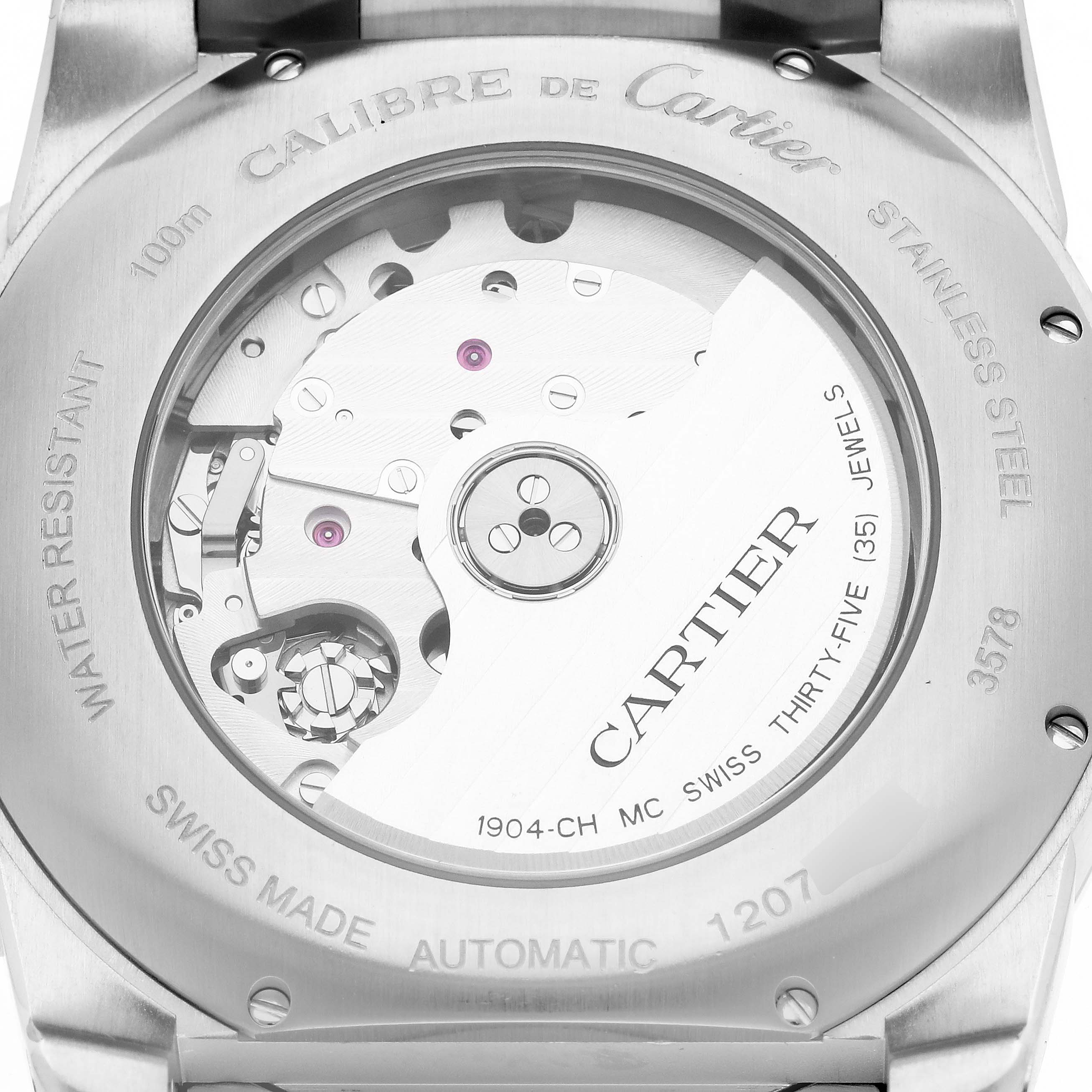 The image shows the back view of a Calibre de Cartier watch by Cartier, displaying its automatic movement and internal mechanism.