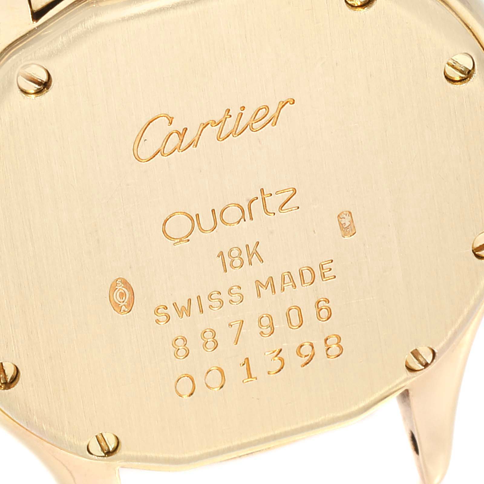 This image shows the engraved back case of a Cartier Panthere 887906 Women's Yellow Gold Silver Dial 887906 Women's Yellow Gold Silver Dial Quartz watch, indicating it is made of 18K gold.