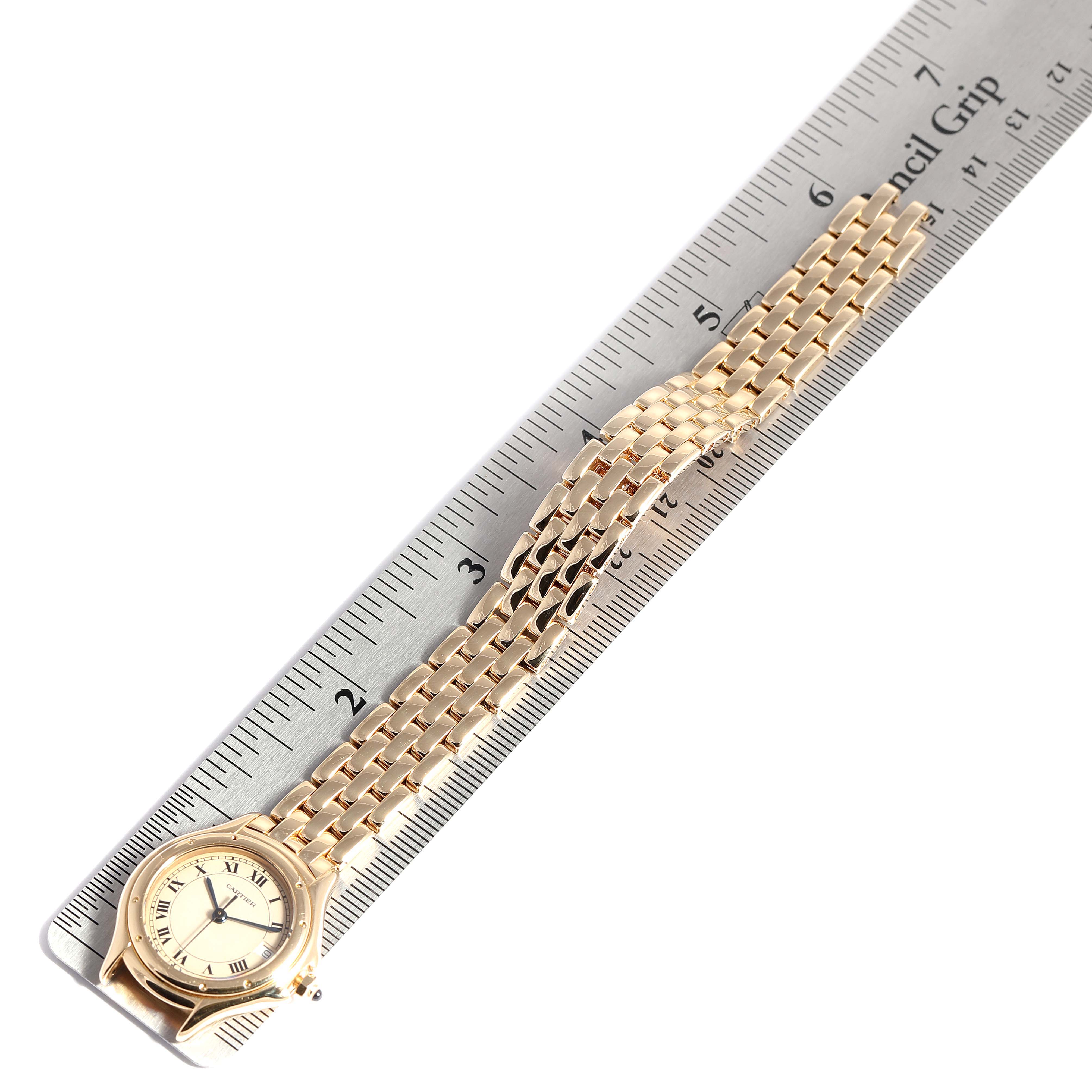 This image shows the Panthere model watch by Cartier from an overhead angle, alongside a ruler for scale.