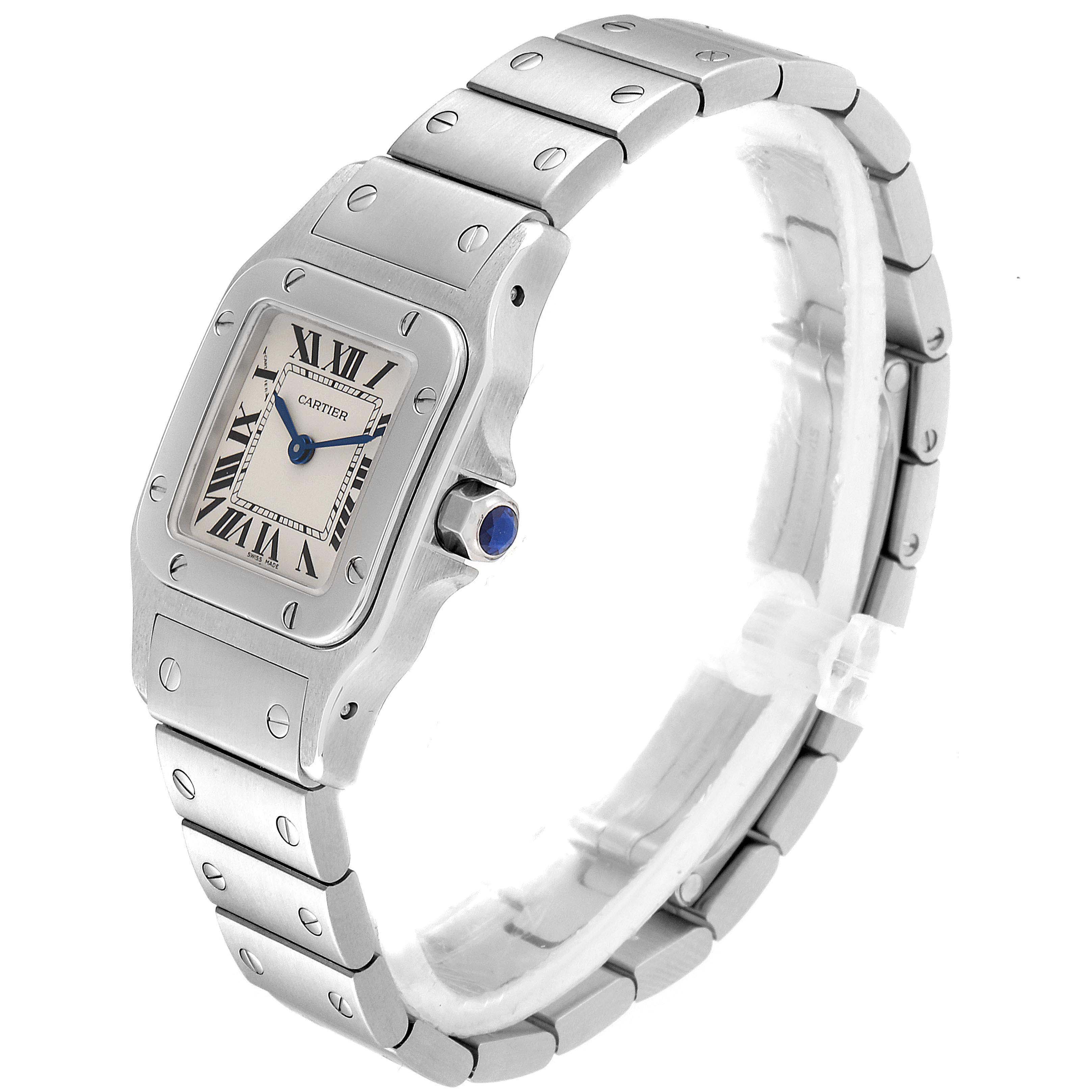 The image shows a Cartier Santos W20056D6 Women's Stainless Steel Silver Dial W20056D6 Women's Stainless Steel Silver Dial watch from an oblique angle highlighting the face, bezel, crown, and part of the bracelet.