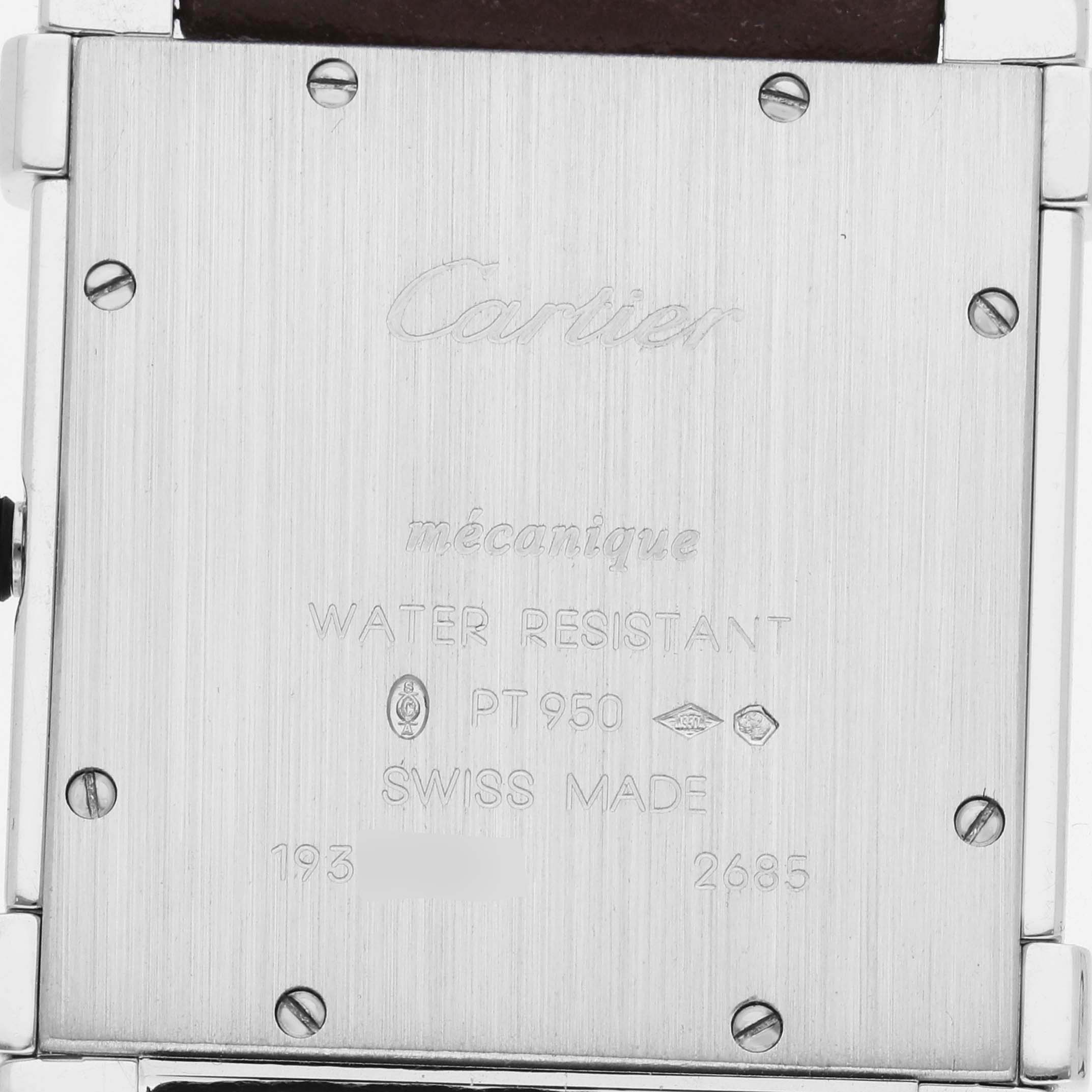 The image shows the back of a Cartier Tank Louis WE300251 Men's Platinum Silver Dial WE300251 Men's Platinum Silver Dial watch, displaying engraved details and screw placements.