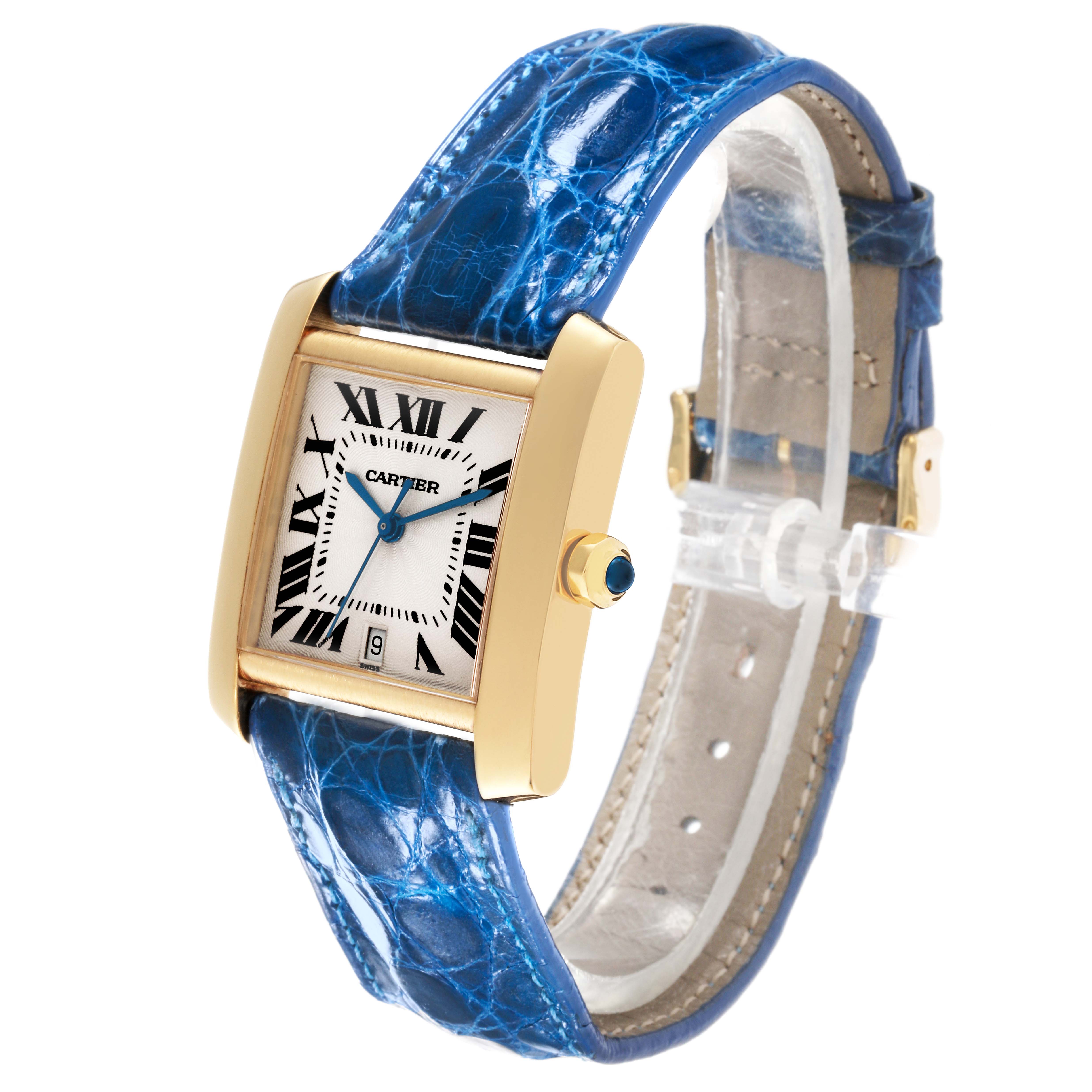 The Cartier Tank Francaise W5000156 Men
s Yellow Gold Silver Dial W5000156 Men
s Yellow Gold Silver Dial watch is shown at a 3/4 angle, featuring its rectangular face, gold case, and blue leather strap.