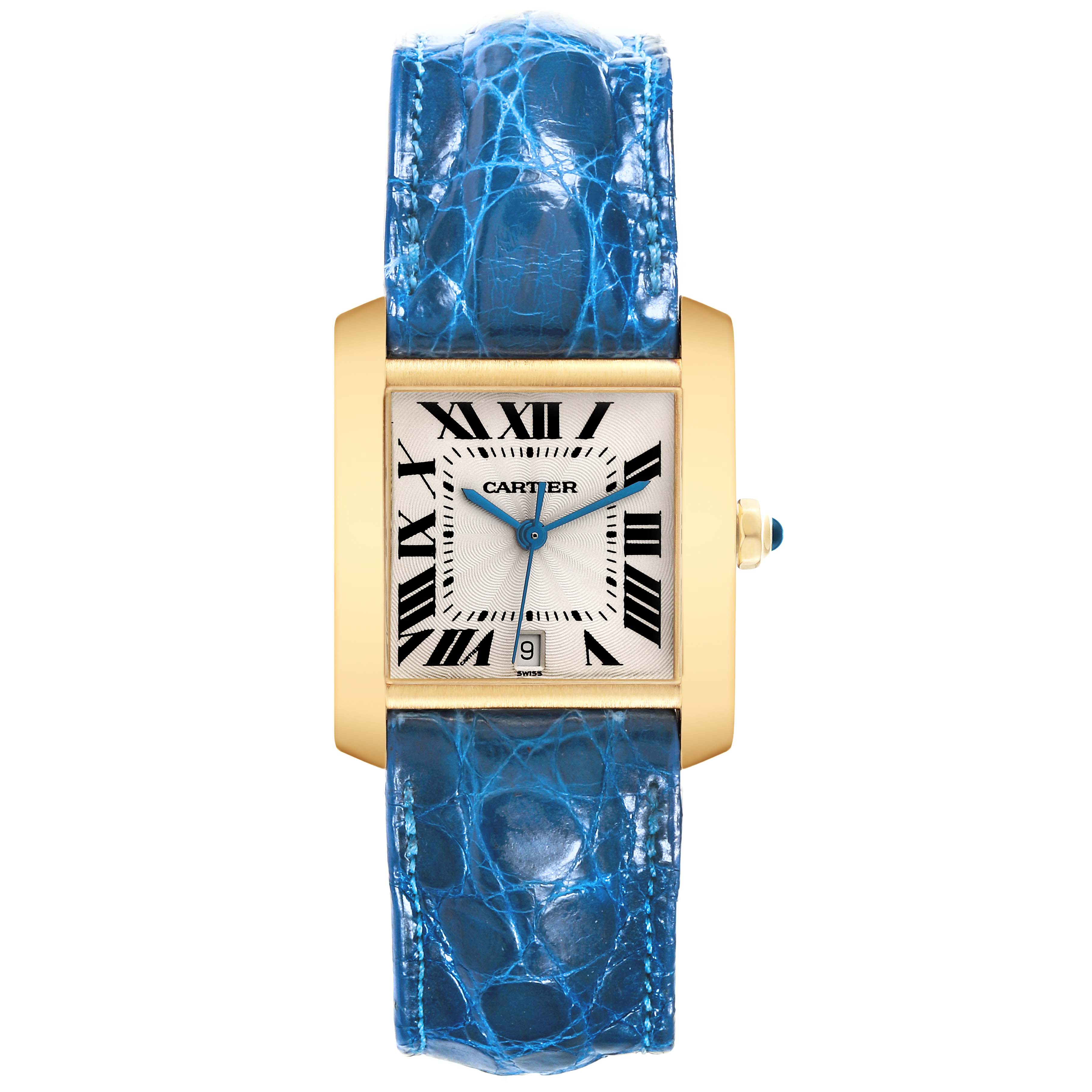 The image shows a Cartier Tank Francaise W5000156 Men
s Yellow Gold Silver Dial W5000156 Men
s Yellow Gold Silver Dial watch from a front view, featuring a gold case and blue leather strap.