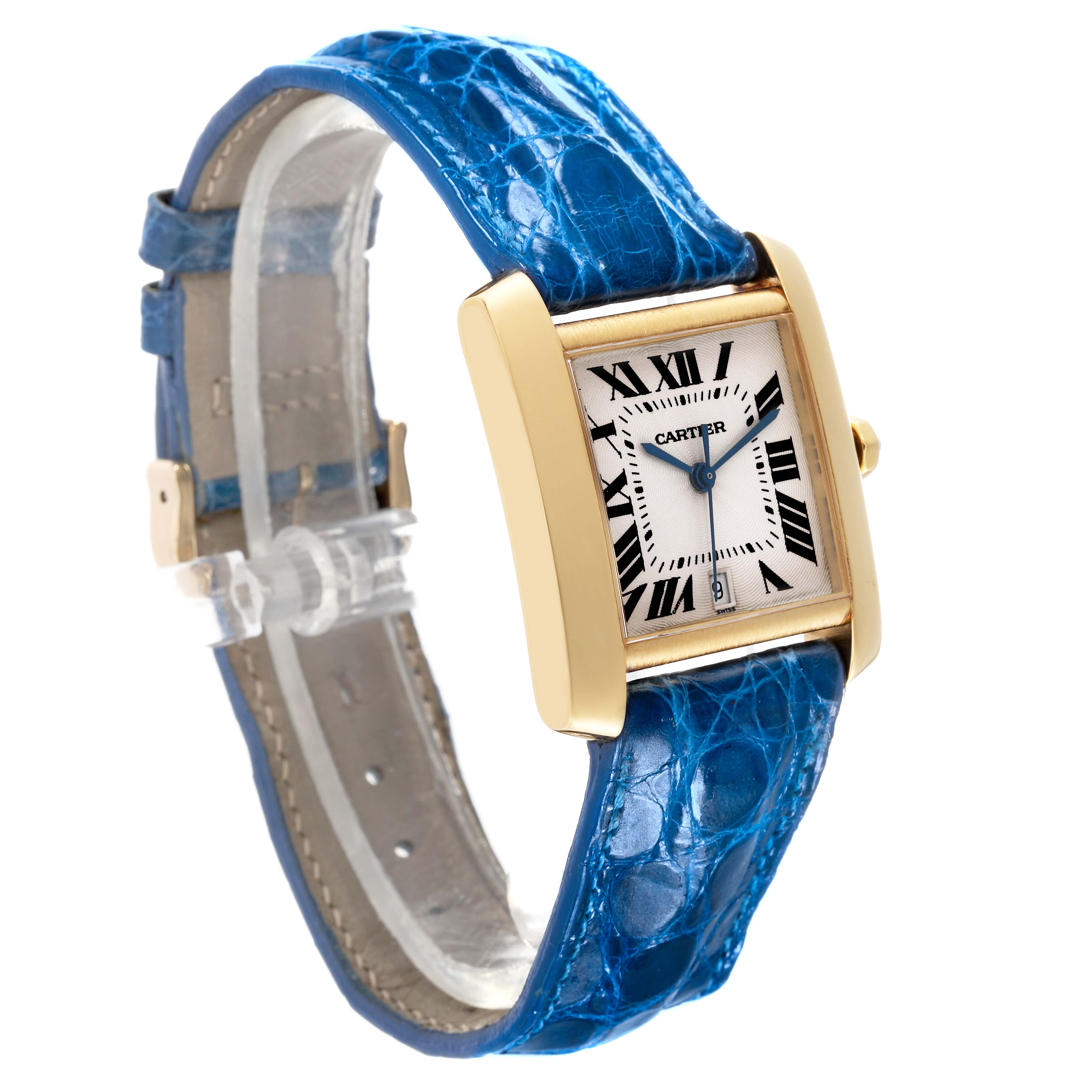 The Cartier Tank Francaise W5000156 Men
s Yellow Gold Silver Dial W5000156 Men
s Yellow Gold Silver Dial watch is shown at an angle highlighting the blue alligator strap and rectangular gold case.