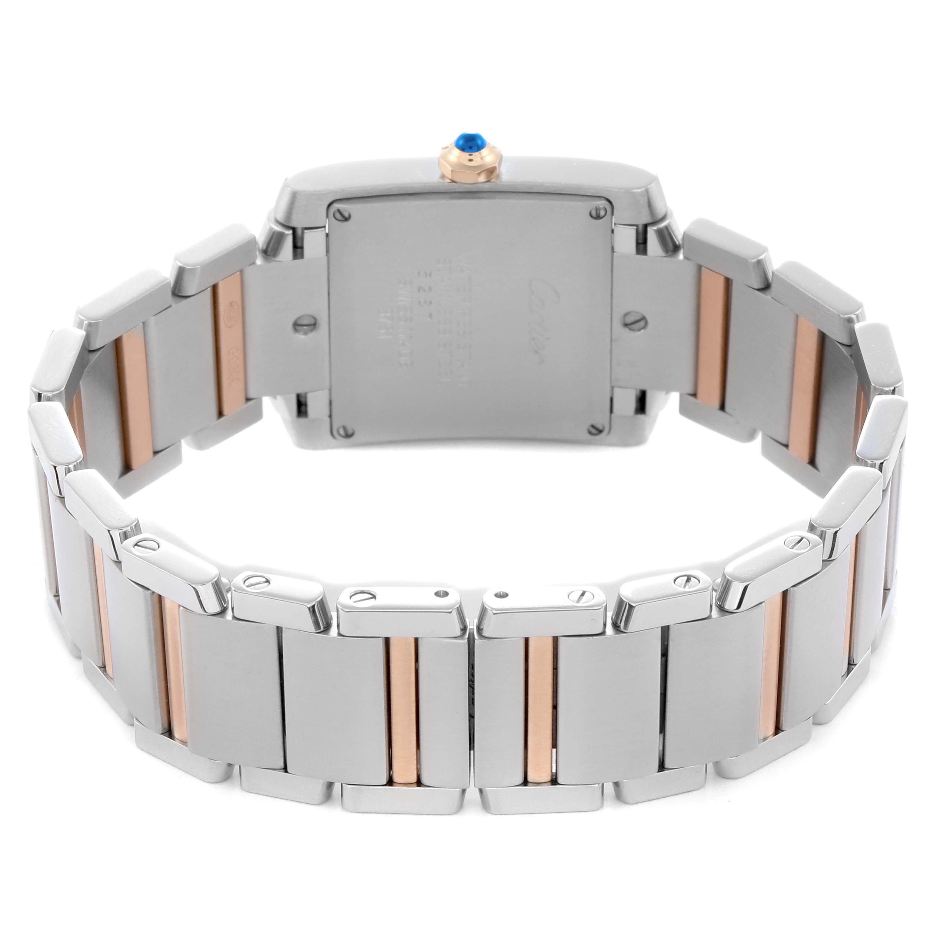 The image shows the back and bracelet of a Cartier Tank Française watch, highlighting the two-tone metal links and case back.
