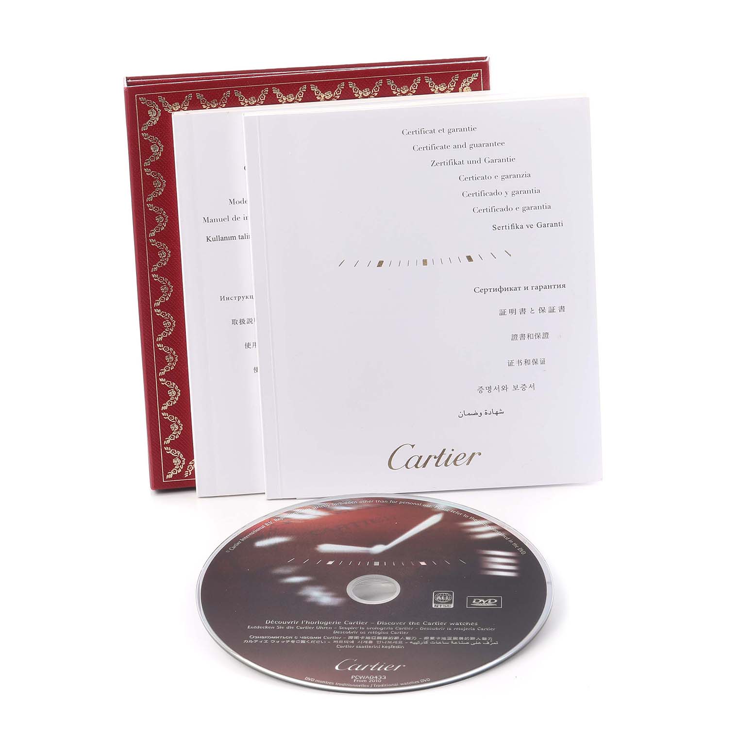 The image shows Cartier Tank Solo W1018755 Women
s Yellow Gold Silver Dial W1018755 Women
s Yellow Gold Silver Dial
s accessories including a booklet, certificate, and a CD, at an angled view.