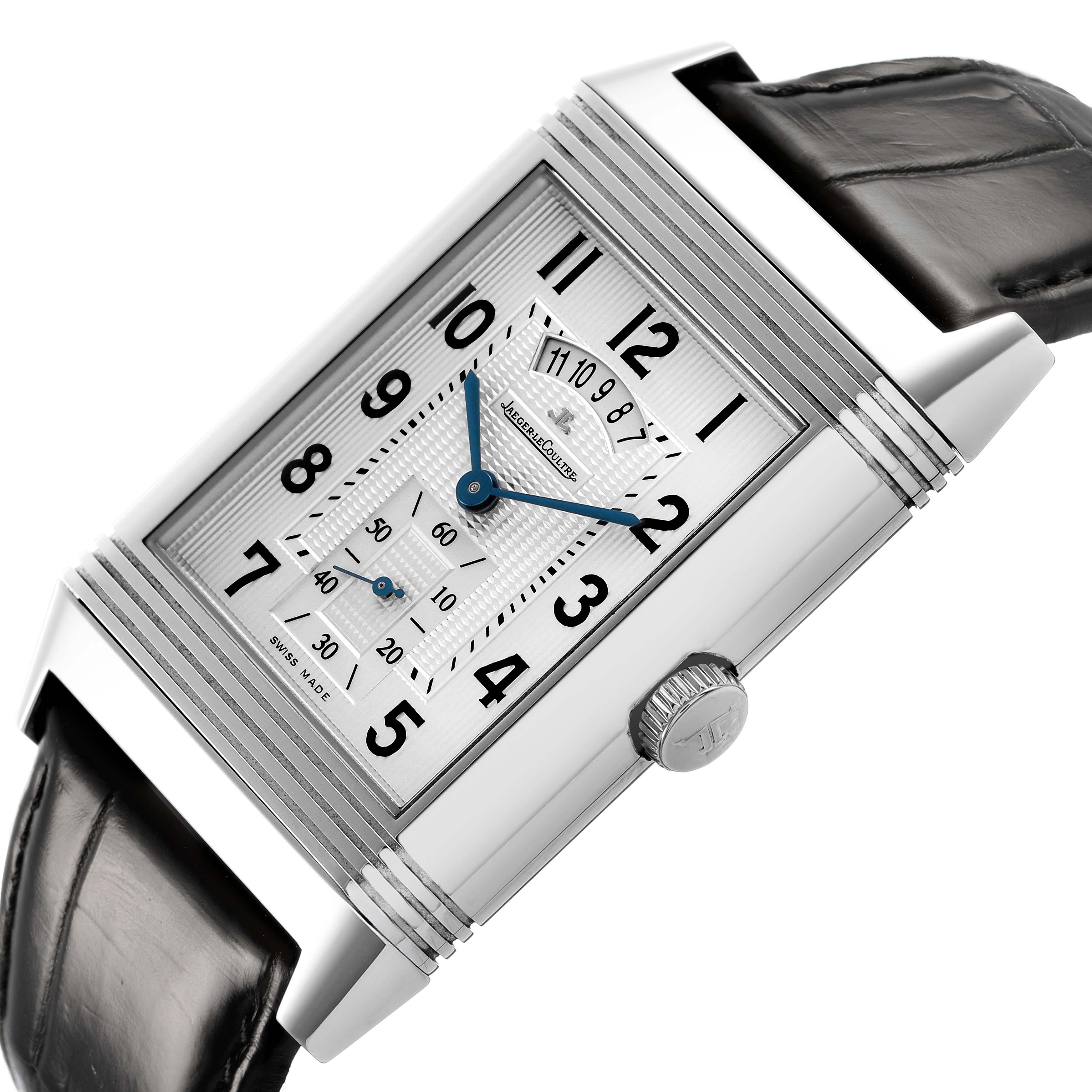 The Jaeger-LeCoultre Reverso watch is shown at an angled view, highlighting the rectangular case, crown, and black leather strap.