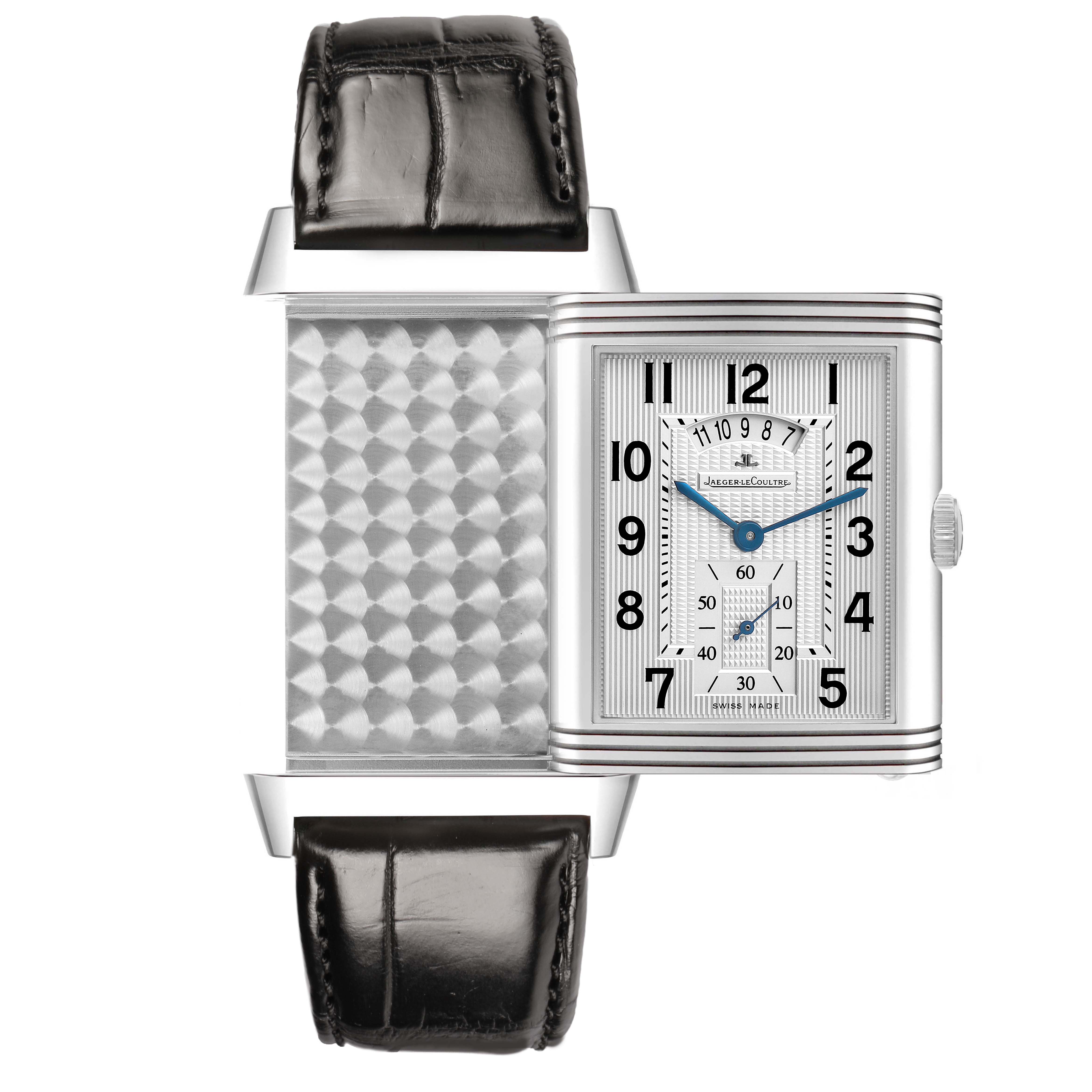 The Jaeger-LeCoultre Reverso watch is shown in an open position, displaying both the face and the decorative reverse side.