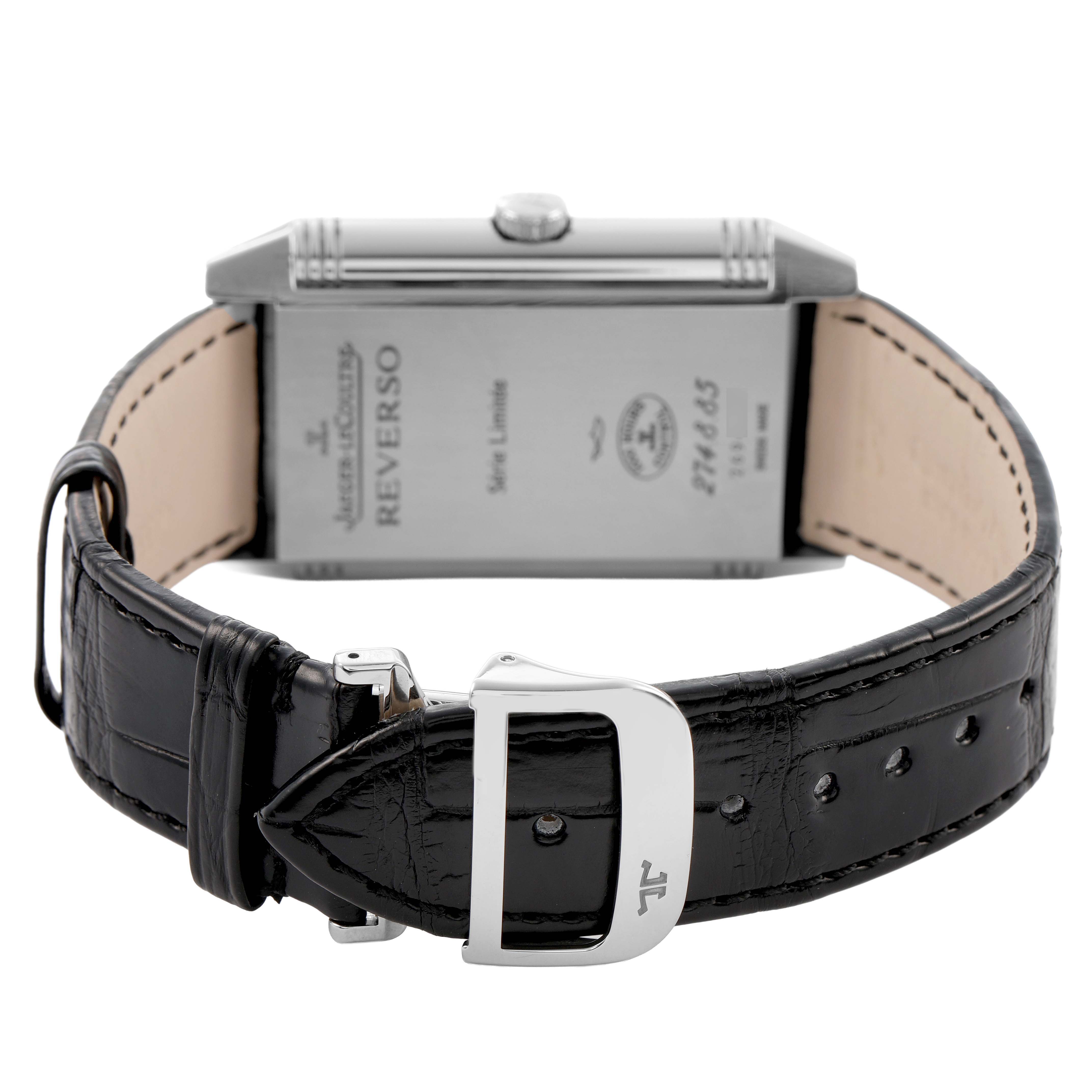 The Jaeger-LeCoultre Reverso watch is shown from the side and back, highlighting the case, crown, and black leather strap with buckle.