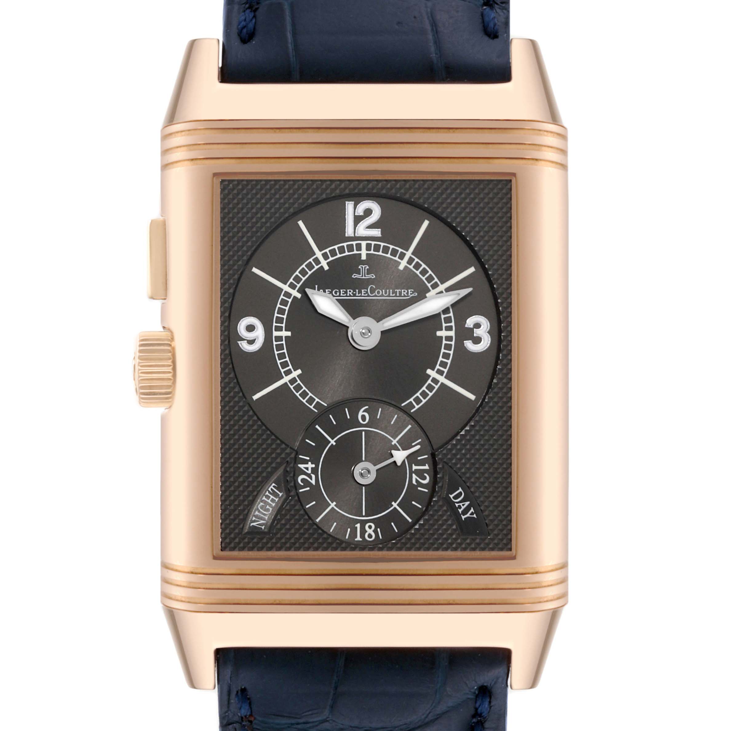 The image shows a front view of the Jaeger-LeCoultre Reverso watch, displaying its face, crown, and part of the strap.