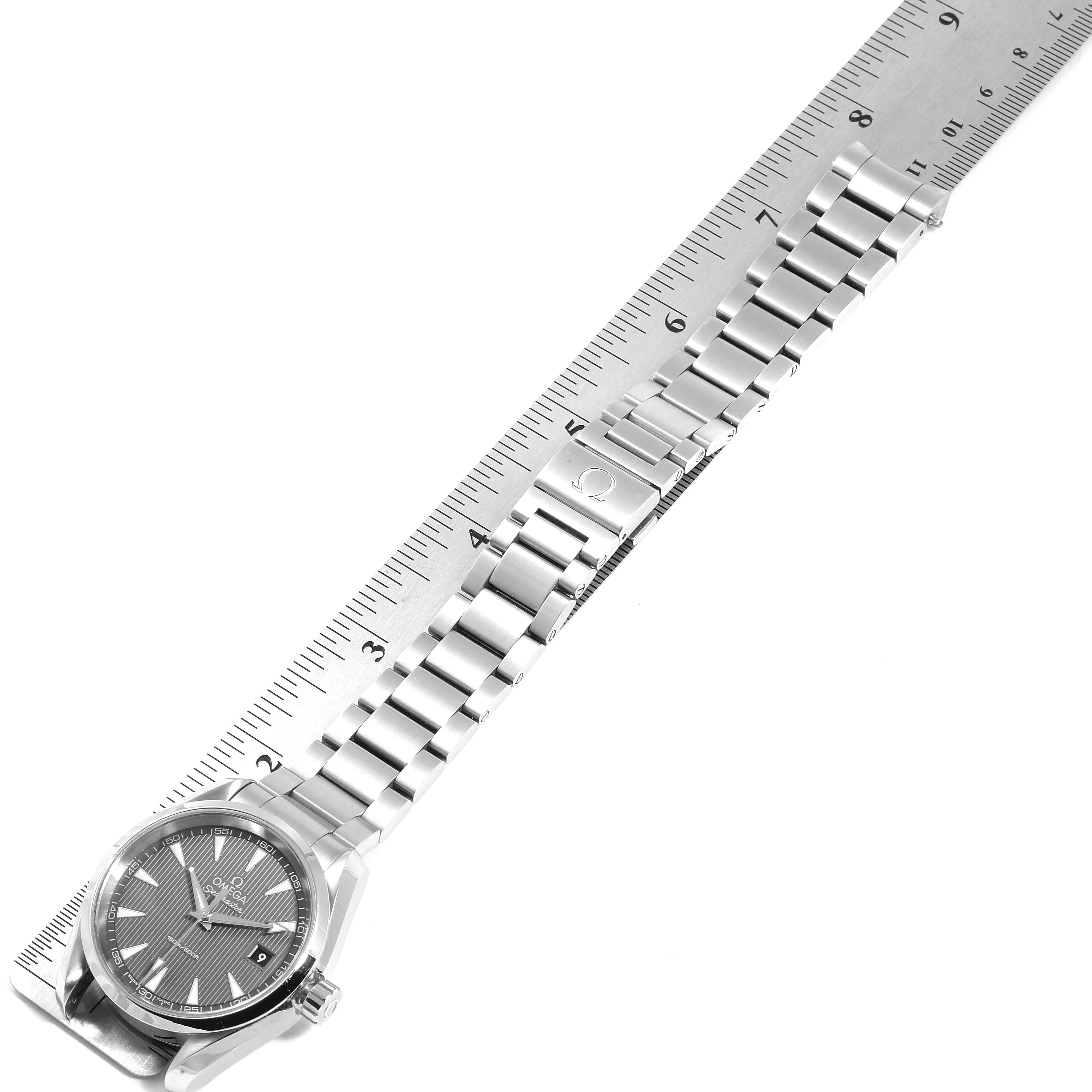 The image shows an Omega Seamaster 231.10.39.60.06.001 Men's Stainless Steel Grey Dial 231.10.39.60.06.001 Men's Stainless Steel Grey Dial watch and its bracelet, with a ruler measuring the length. The watch is viewed from above.