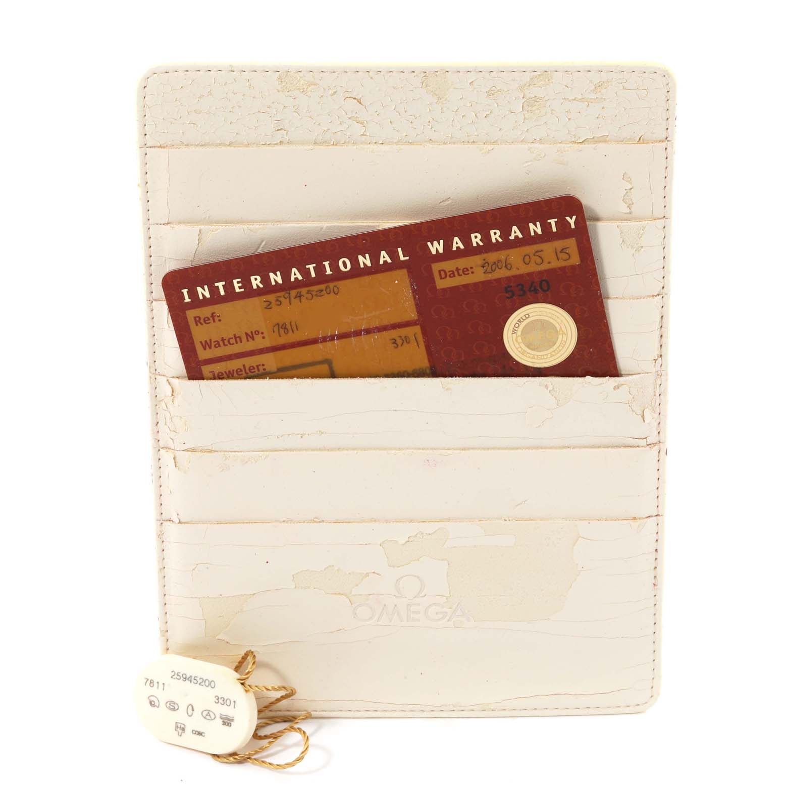 This image shows the warranty card and identification tag for an Omega Seamaster 2594.52.00 Men
s Stainless Steel Black Dial 2594.52.00 Men
s Stainless Steel Black Dial watch.