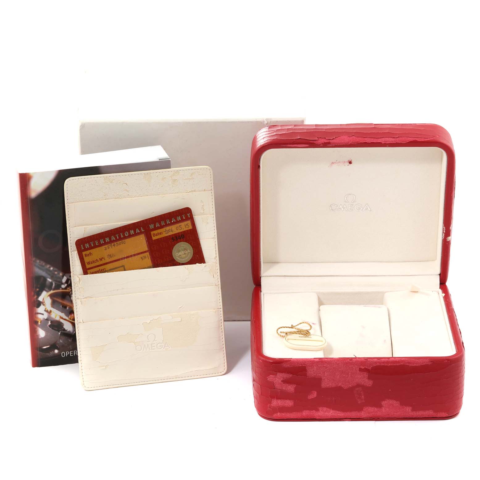 The image shows the packaging, warranty card, and accessories for an Omega Seamaster 2594.52.00 Men
s Stainless Steel Black Dial 2594.52.00 Men
s Stainless Steel Black Dial watch.