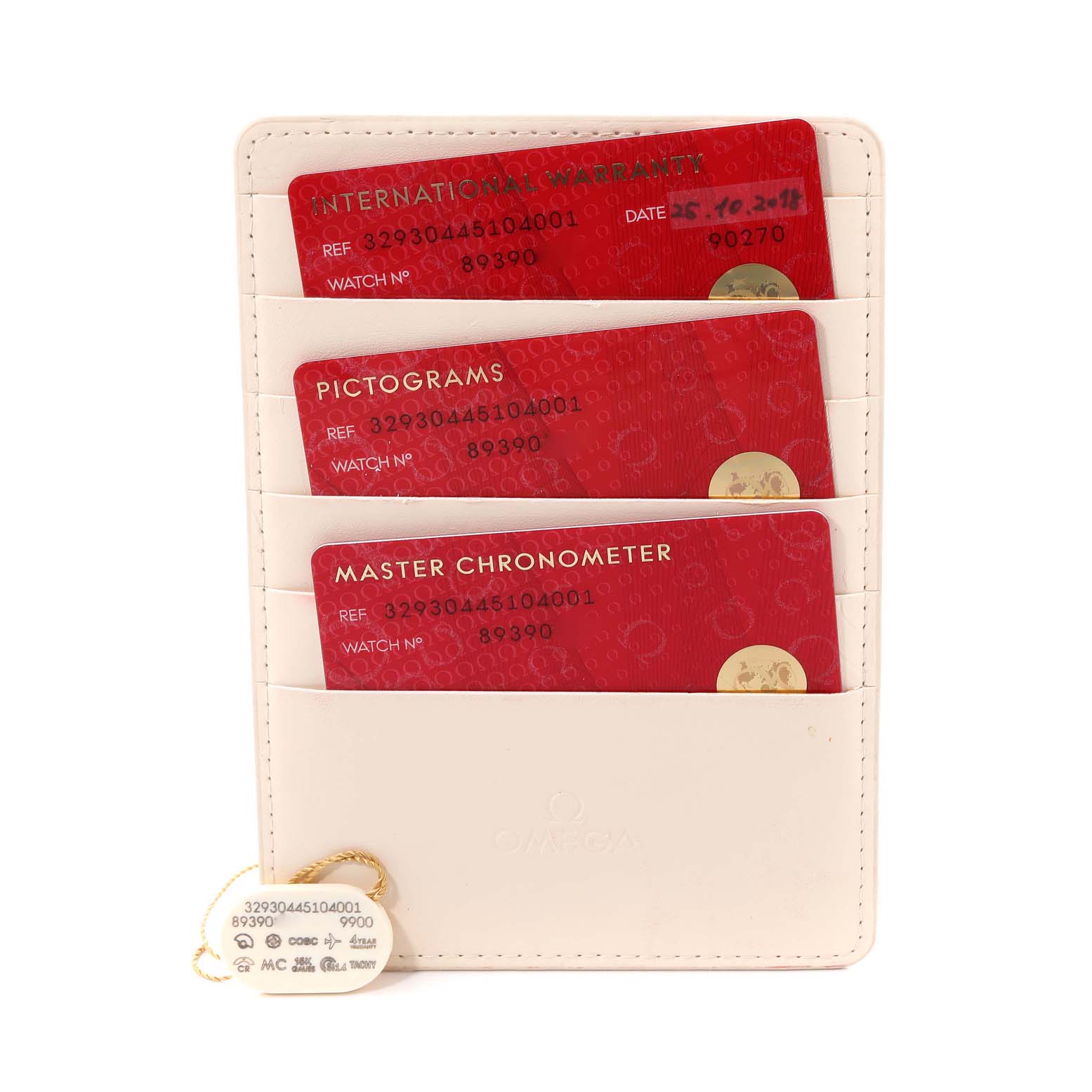 The image shows warranty cards and certifications for an Omega Speedmaster 329.30.44.51.04.001 Men's Stainless Steel White Dial 329.30.44.51.04.001 Men's Stainless Steel White Dial watch placed in a white cardholder.