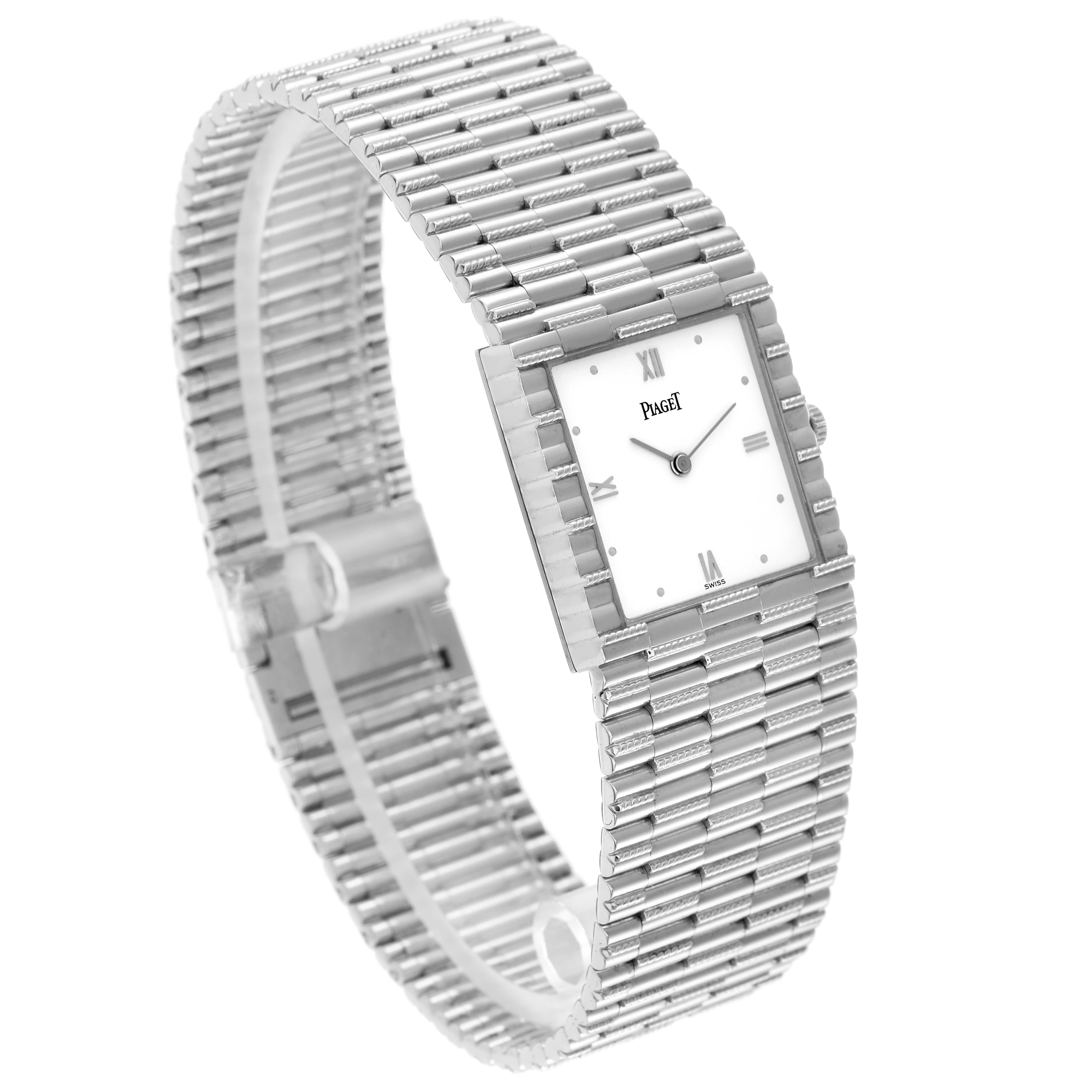 The Piaget 80131G2 Women
s White Gold White Dial 80131G2 Women
s White Gold White Dial 80131 model is shown at a three-quarter angle, highlighting its white gold bracelet, rectangular face, and dial.