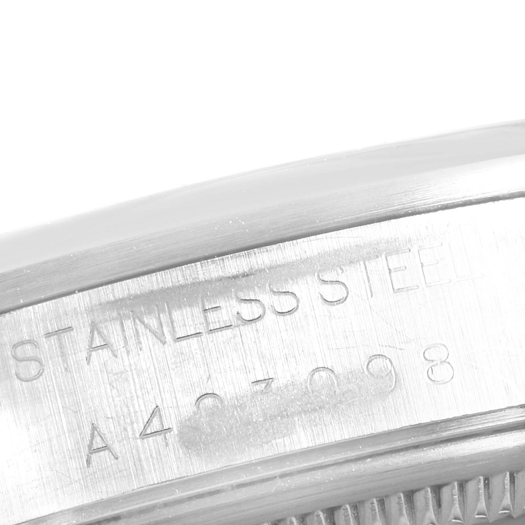 This is a close-up of the serial number and “stainless steel” engraving on the side of a Rolex Air-King 14000 Men's Stainless Steel Black Dial 14000 Men's Stainless Steel Black Dial watch case.