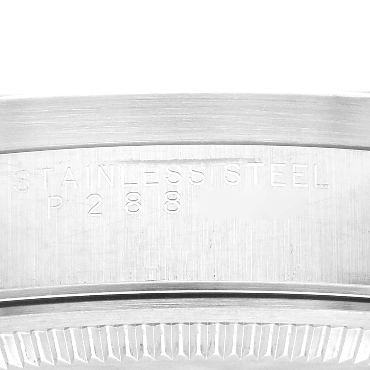 This close-up image shows the stainless steel casing with engraved text on the side of the Rolex Air-King 14010 Men's Stainless Steel Blue Dial 14010 Men's Stainless Steel Blue Dial watch.