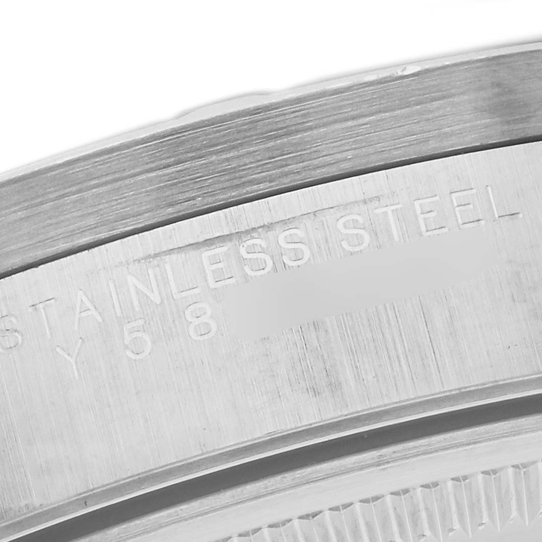 The image shows a close-up of the stainless steel casing and partially visible serial number of a Rolex Air-King 14010M Men's Stainless Steel Black Dial 14010M Men's Stainless Steel Black Dial watch.
