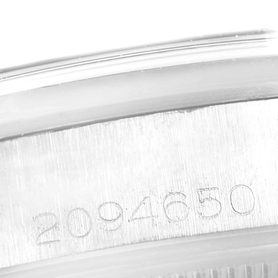 This close-up image shows the engraved serial number on the casing of a Vintage Collection model by Rolex.